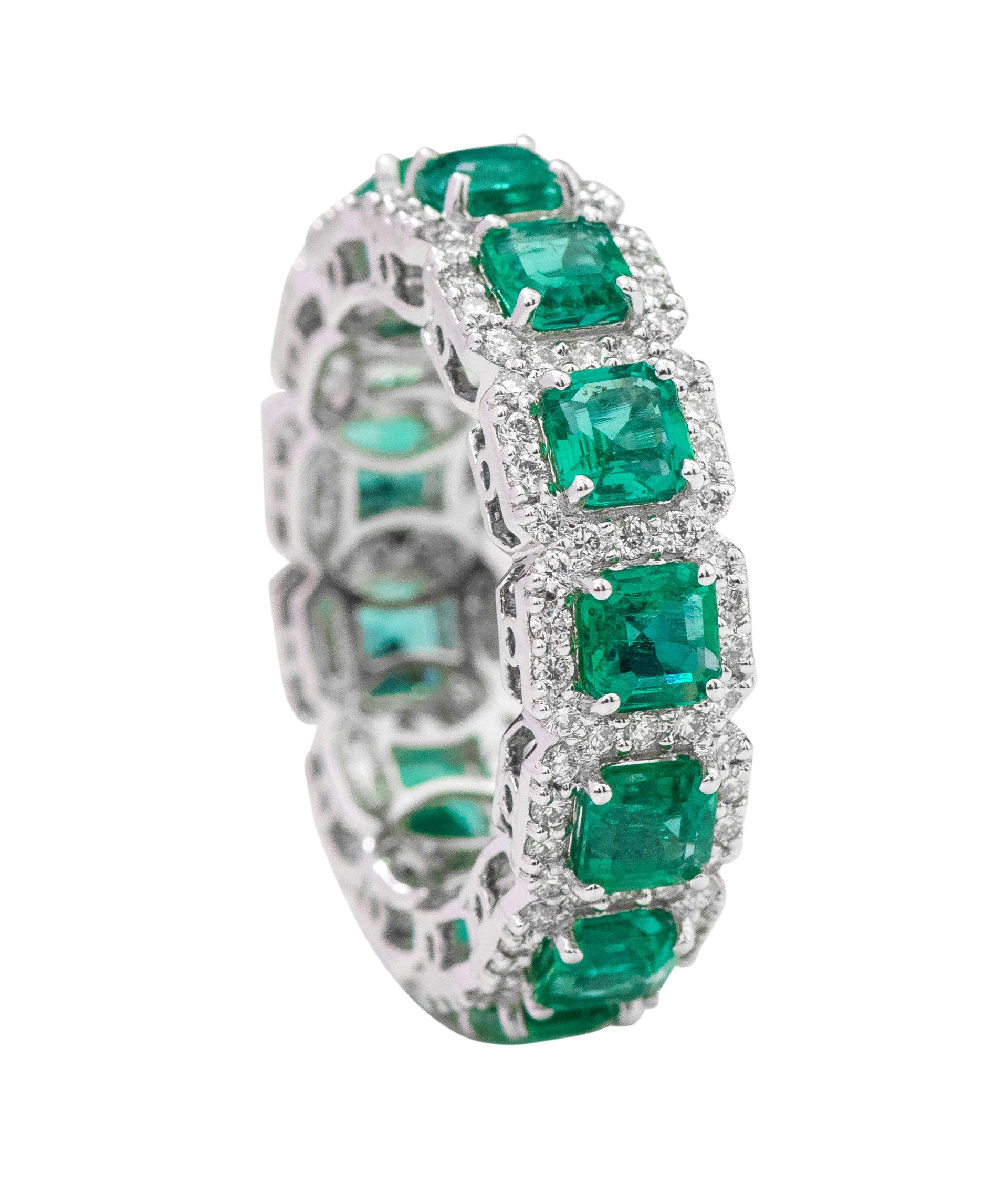 18 Karat White Gold 4.12 Carat Emerald-Cut Natural Emerald and Diamond Eternity Band Ring

This masterful lush green emerald and diamond cluster band is remarkably brilliant. The solitaire emerald-cut emeralds are magnificently surrounded with a