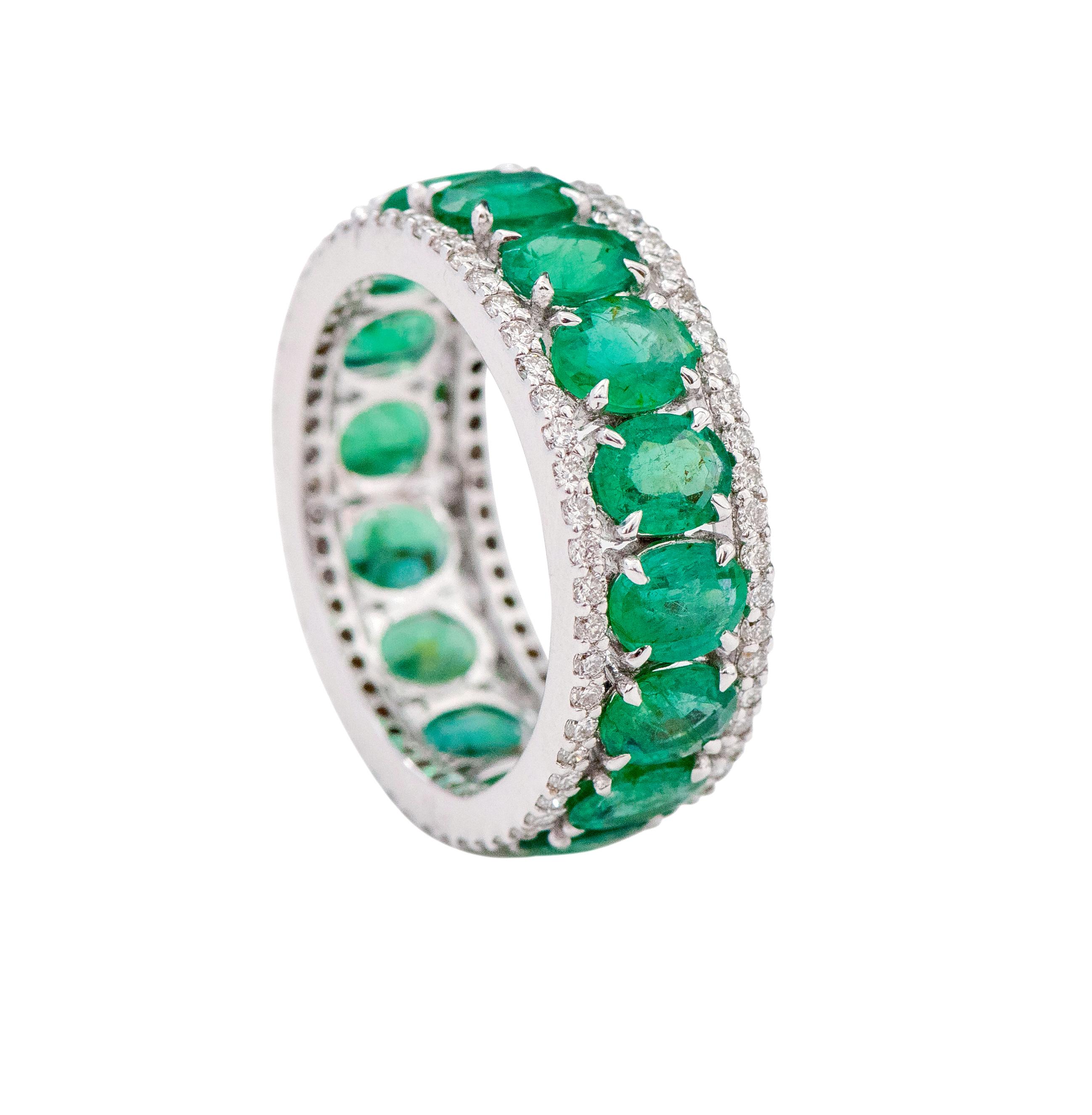18 Karat White Gold 4.74 Carat Oval-Cut Natural Emerald and Diamond Eternity Band Ring

This impeccable shamrock green emerald and diamond band is exquisite. The solitaire horizontally placed oval shape emeralds in grain prong setting are