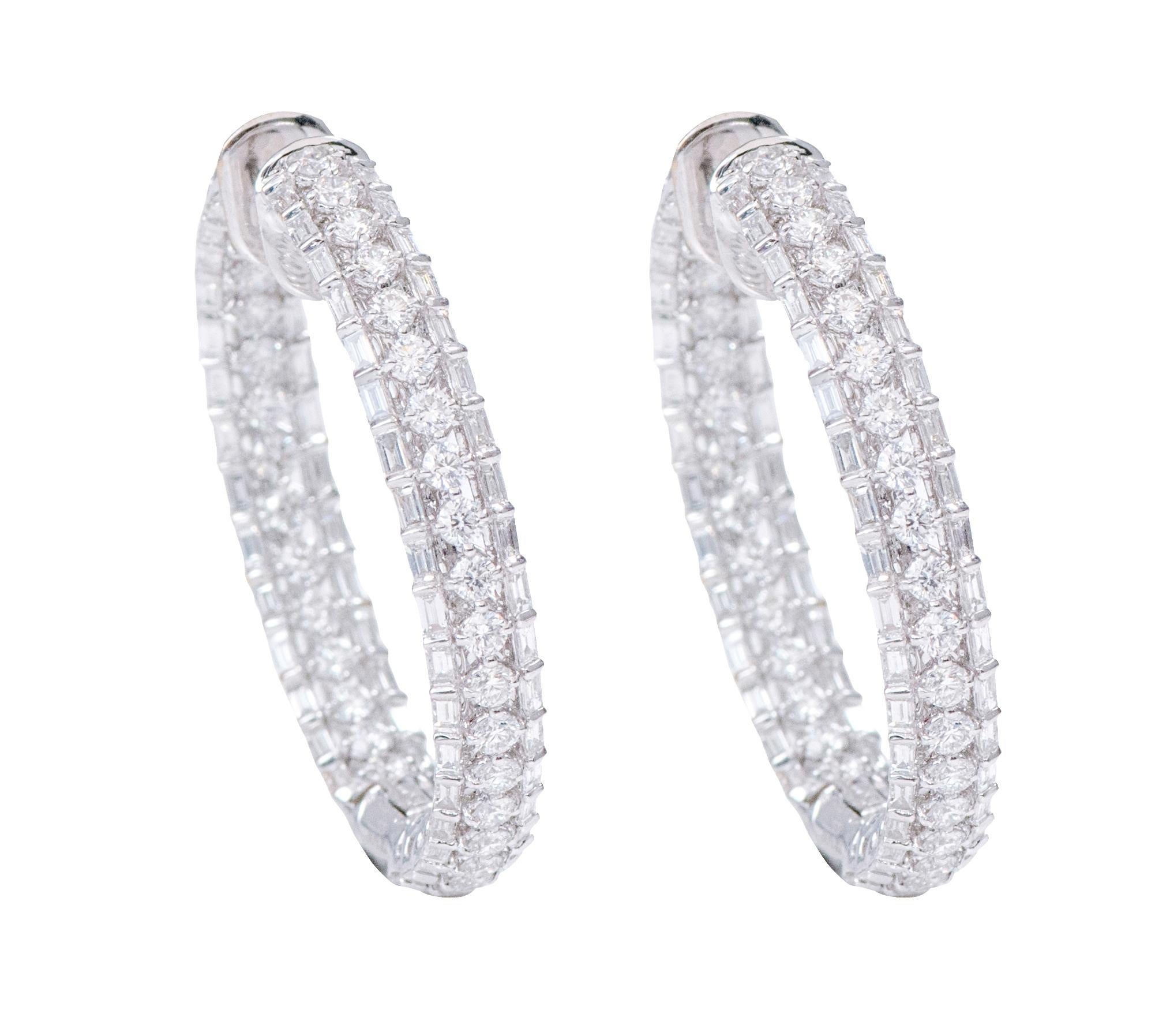 18 Karat White Gold 4.96 Carats Diamond Hoop Earrings

This adorable and fashionable triple-layer hoop earring with the combination of prong set brilliant round diamonds covered by the closed set baguette side diamonds both inside and outside is an