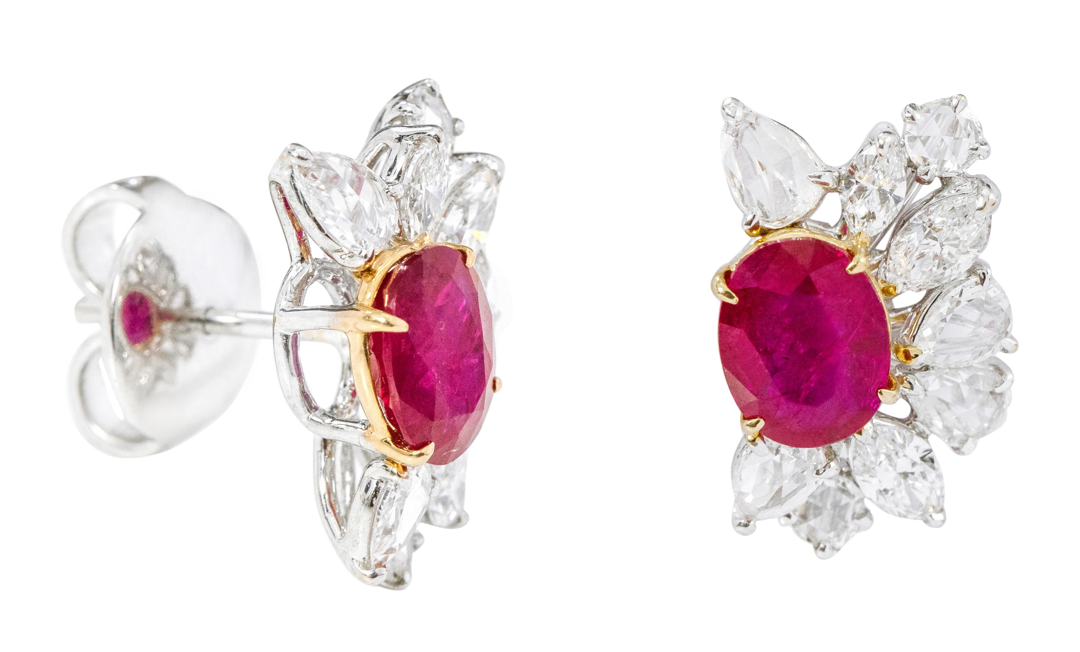 18 Karat White Gold 4.96 Carats Ruby and Diamond Statement Stud Earrings

This glorious pigeon blood red ruby and diamond earring is sensational. The solitaire oval ruby with a leveled up and down solitaire rose cut pear and full-cut marquise and