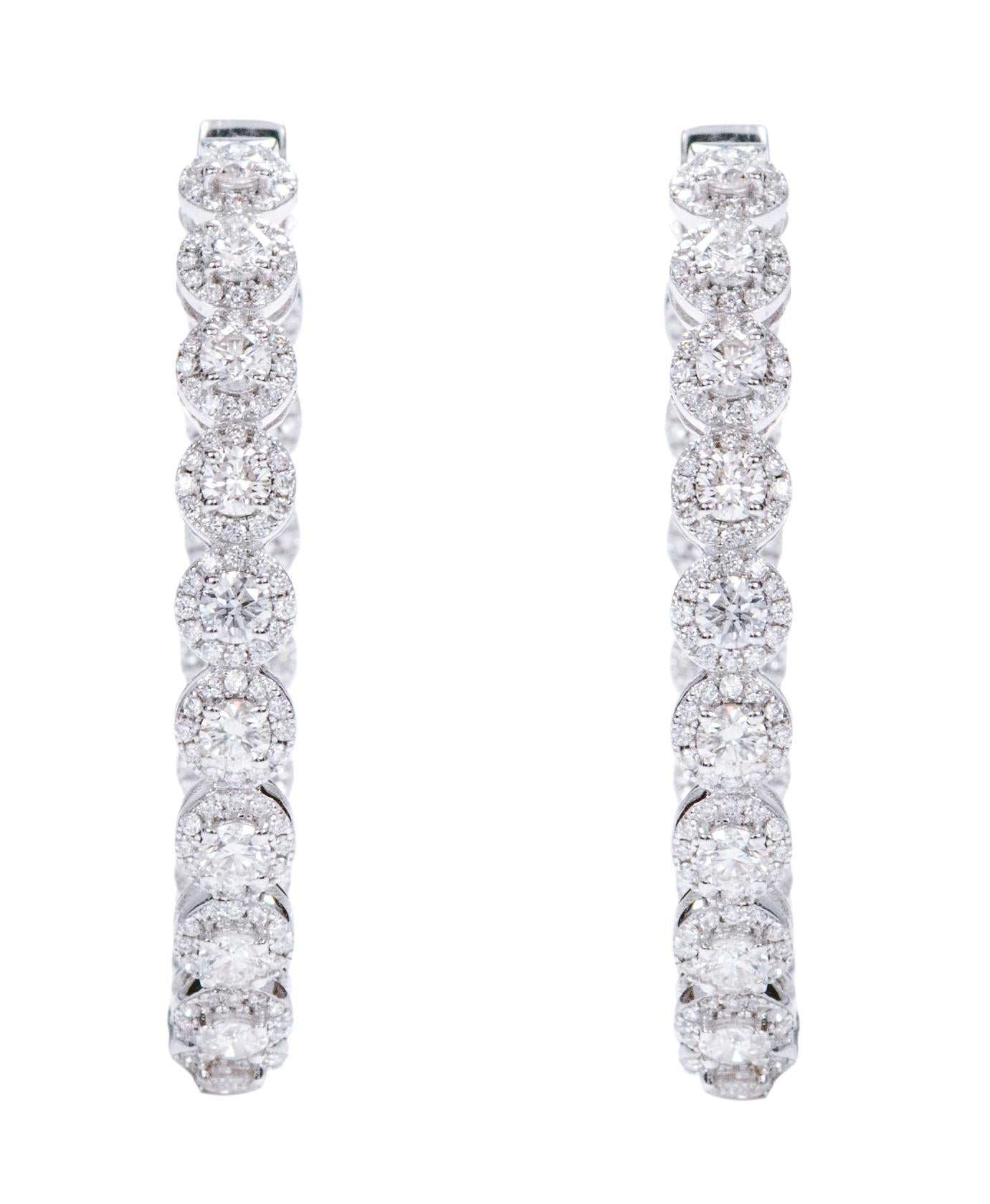 18 Karat White Gold 5.17 Carat Brilliant-Cut Diamond Cluster Hoop Earrings

This is a classy delightful diamond solitaire round hoop earring. The perfect brilliant round diamonds set in white gold prongs are hinted by sophistication with the
