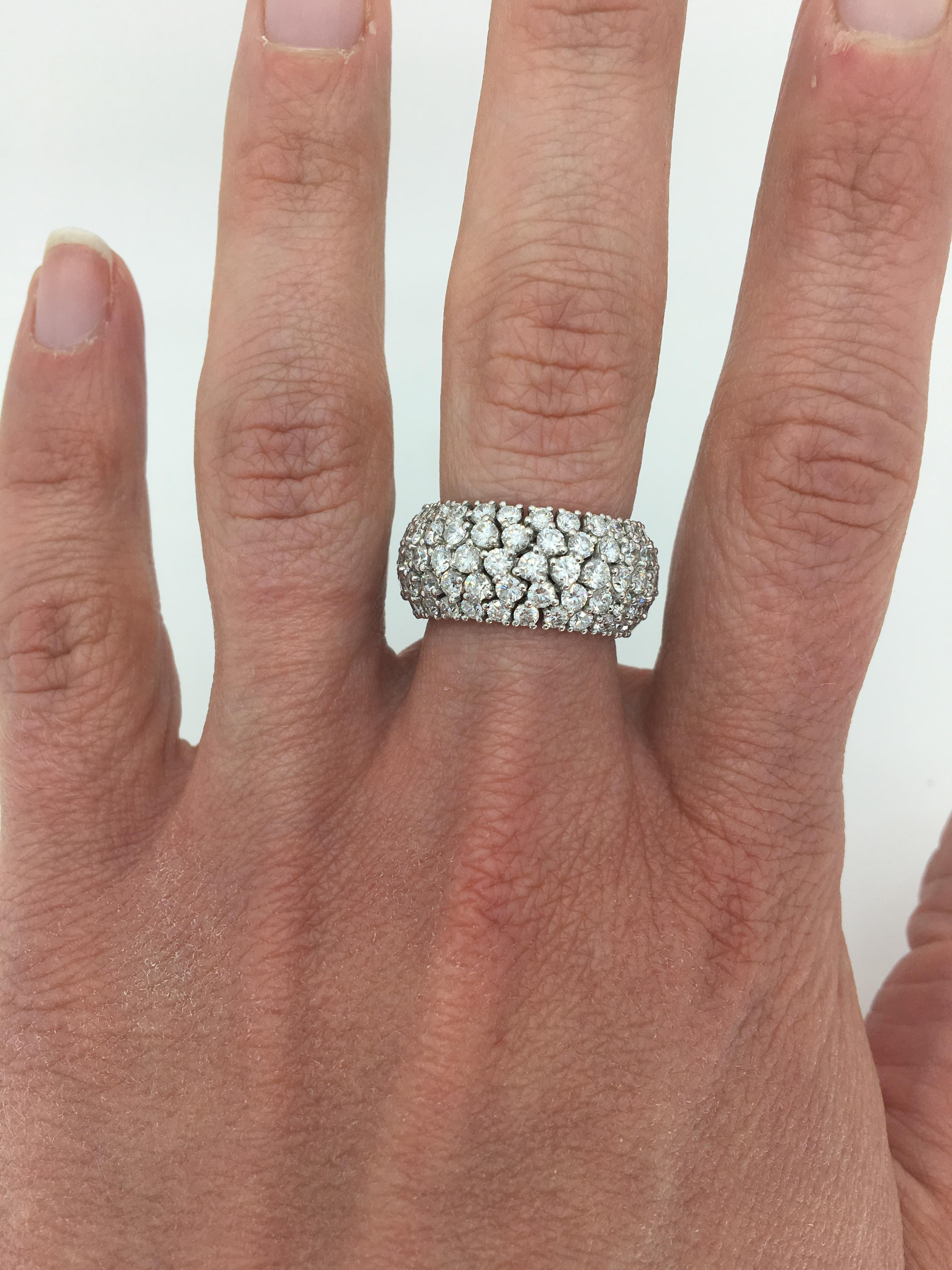 This glamorous Diamond ring features approximately 5.60CTW of Round Brilliant Cut Diamonds set in a unique eternity style band that has movement for a perfect comfort fit.

Diamond Carat Weight: Approximately 5.60CTW
Diamond Cut: 140 Round Brilliant