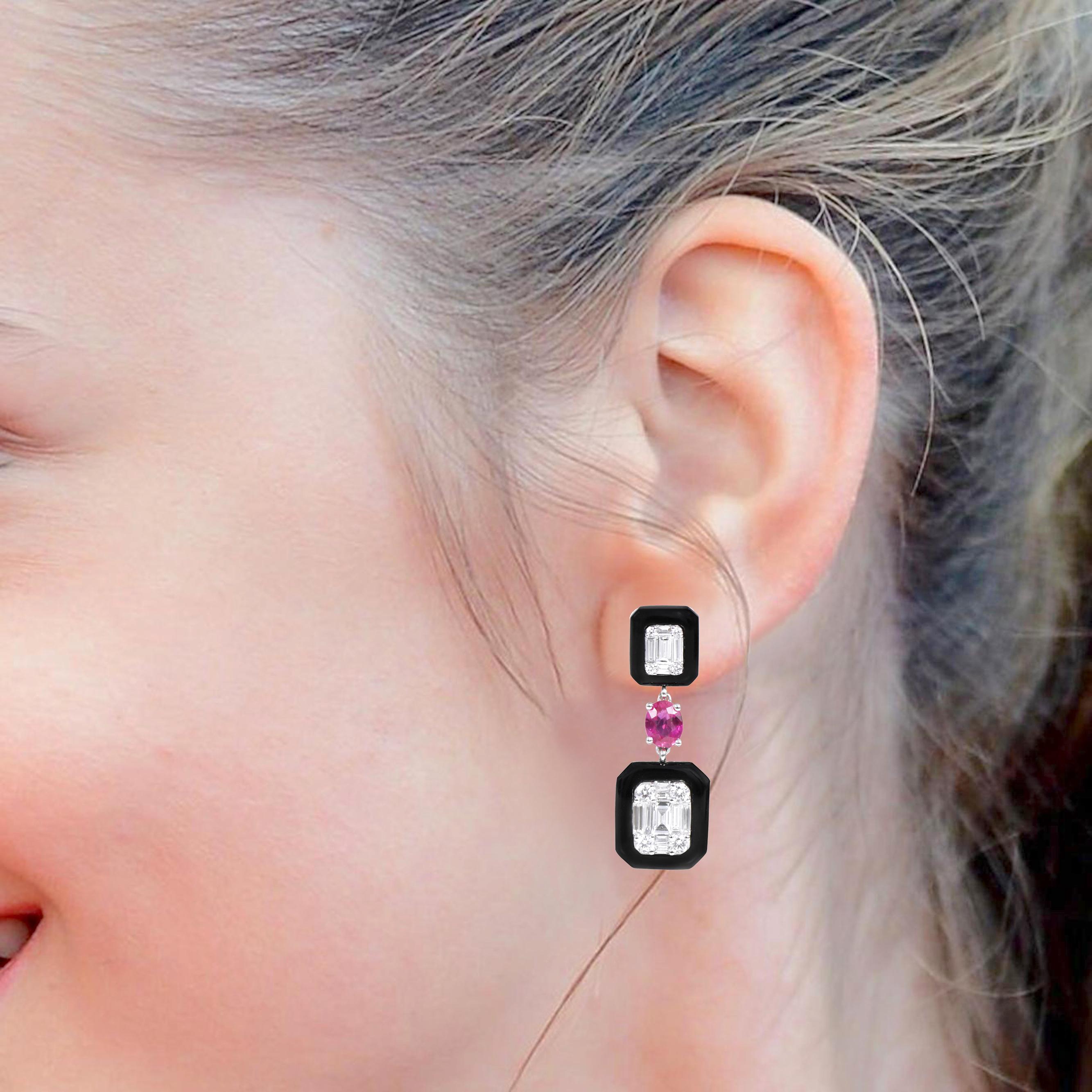 18 Karat White Gold 5.30 Carat Diamond, Ruby, and Black Onyx Dangle Earrings

This contemporary invisible set emerald cut diamond and jet black onyx and wine red ruby long earring is impressive. The bottom half of invisible diamond emerald cut in