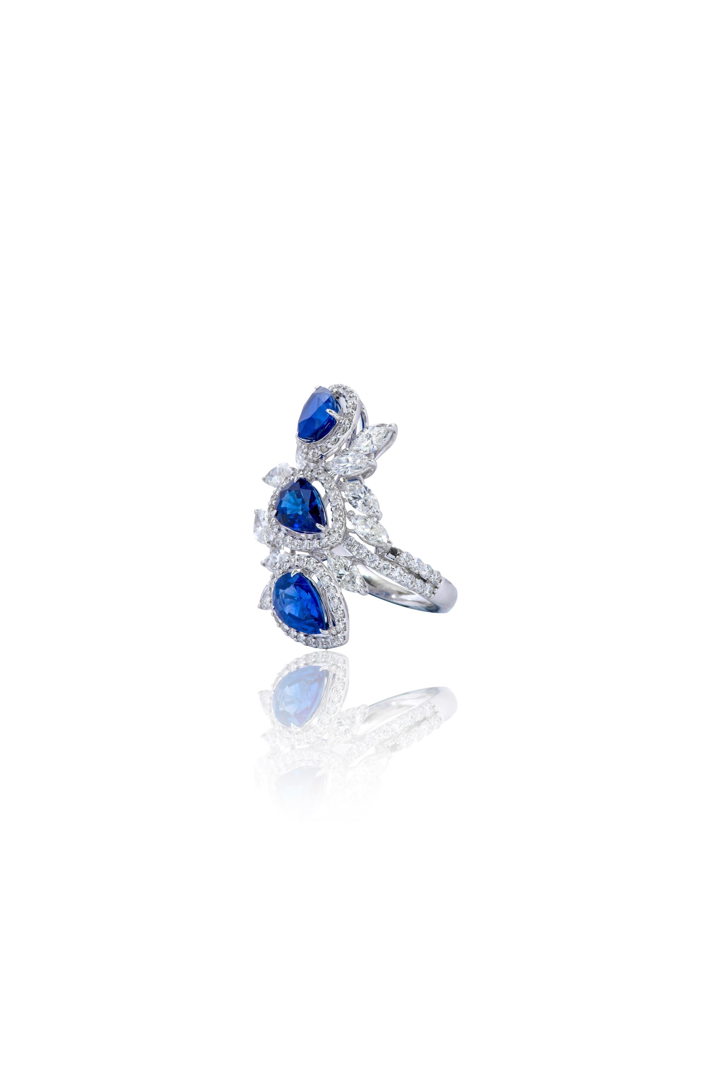 18 Karat White Gold 5.43 Carat Sapphire and Diamond Cocktail Ring 

The cocktail trapezoid blue sapphire pear ring is a masterful design. The blooming floral leaves inspire the ring, as they transcend with the changing season. The royal hue of blue