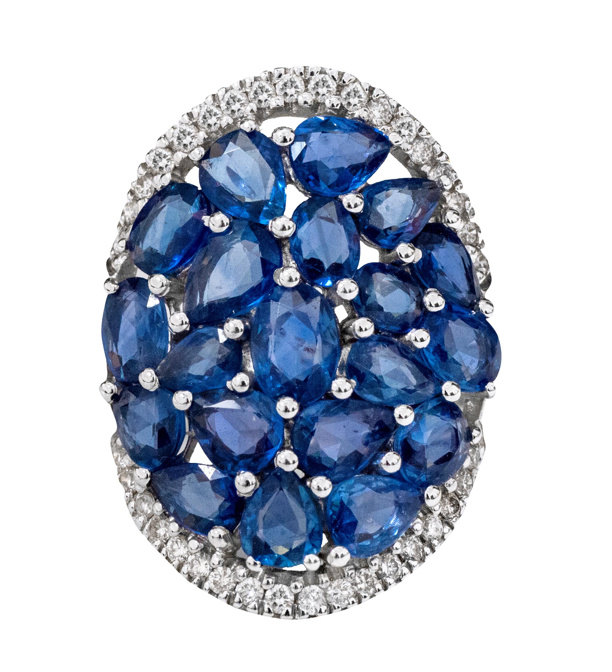 18 Karat White Gold 5.81 Carat Sapphire and Diamond Ring

This magnificent azure blue sapphire and diamond round long cocktail ring is mesmerizing. The mix shape and size of oval and pear-shaped solitaire blue sapphires form the center of the broad
