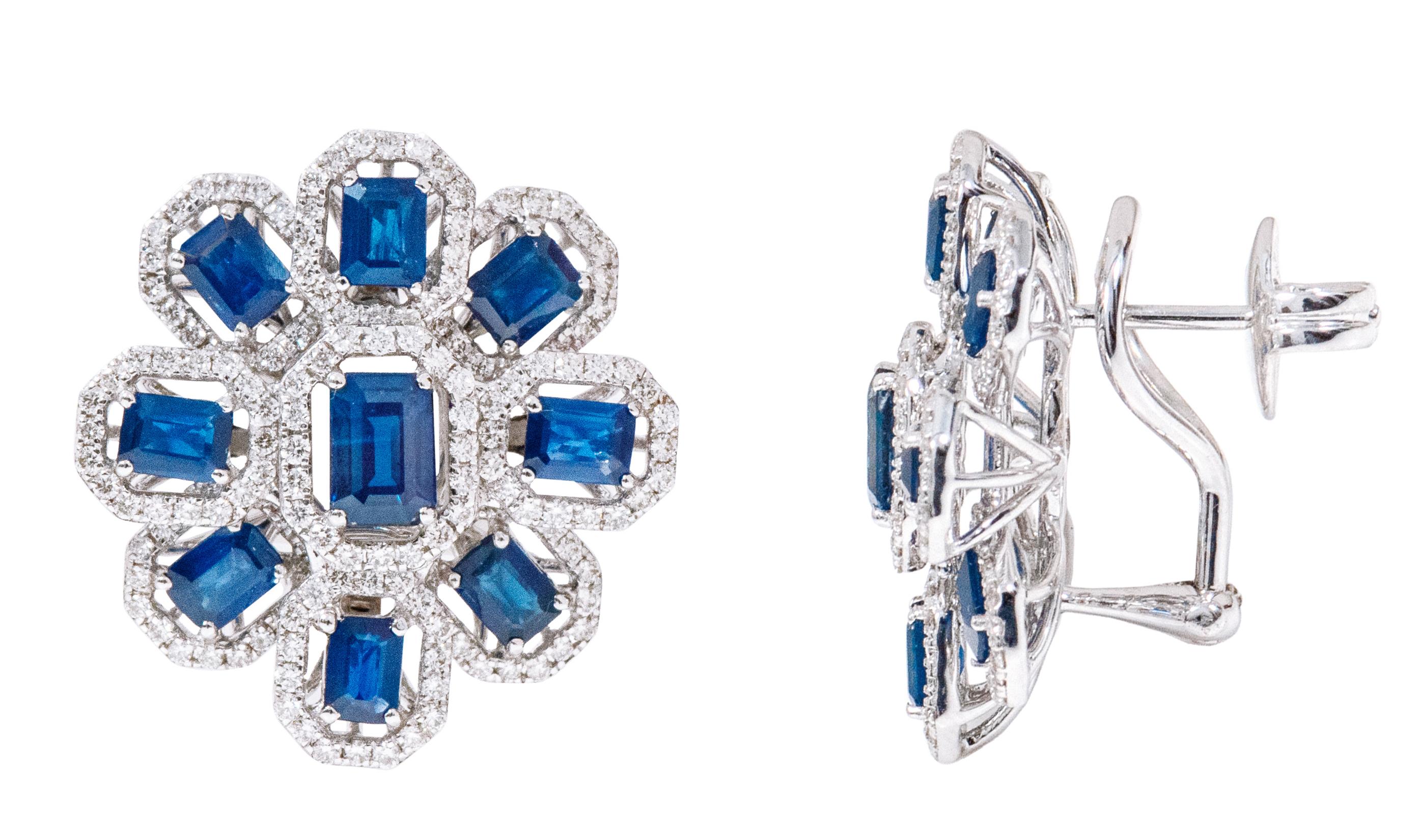 18 Karat White Gold 6.11 Carat Diamond and Sapphire Cocktail Stud Earrings

This classic royal blue sapphire and diamond halo cluster floral style stud earring is palatial. The solitaire emerald cut blue sapphire in 4-prong setting is surrounded