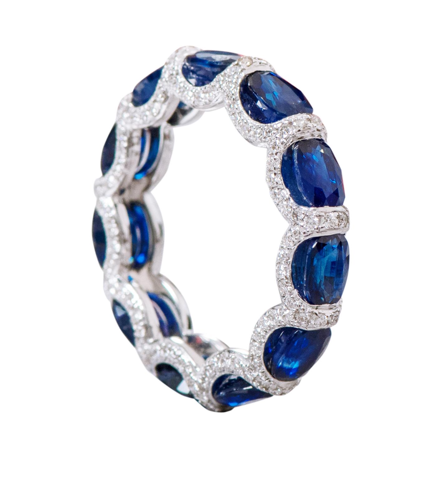 18 Karat White Gold 6.11 Carat Sapphire and Diamond Eternity Band Ring 

This impressive royal blue sapphire and diamond band is elegant. The solitaire horizontally placed oval shape sapphires are brilliantly enclosed in between pave set round