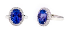 18 Karat White Gold 6.22 Carat Oval-Cut Tanzanite and Diamond Cluster Ring