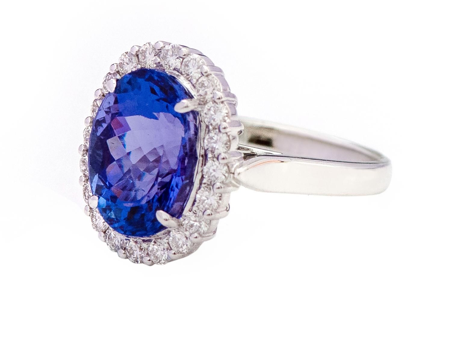 Oval Cut 18 Karat White Gold 6.22 Carat Oval-Cut Tanzanite and Diamond Cluster Ring For Sale