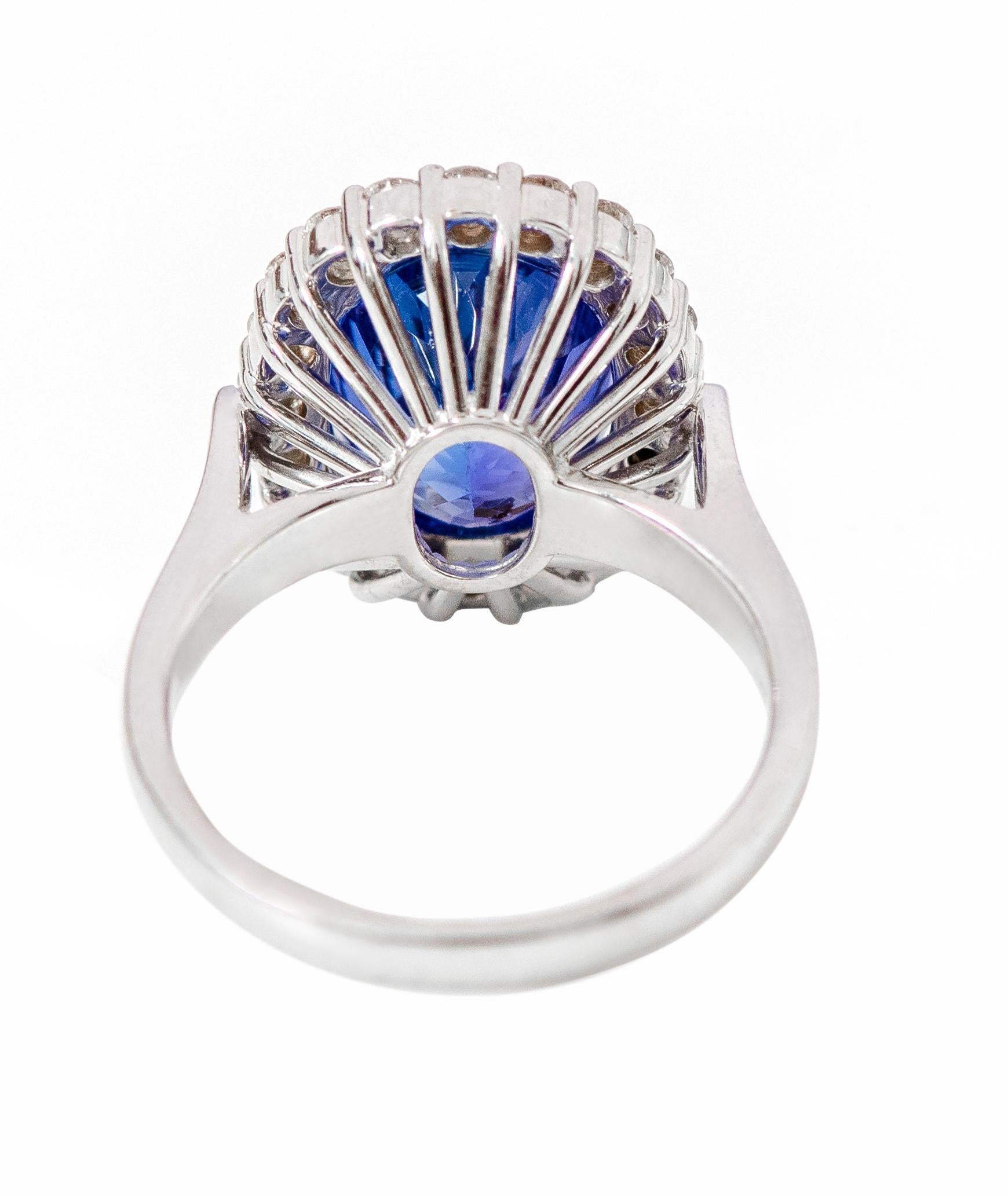 Women's 18 Karat White Gold 6.22 Carat Oval-Cut Tanzanite and Diamond Cluster Ring For Sale