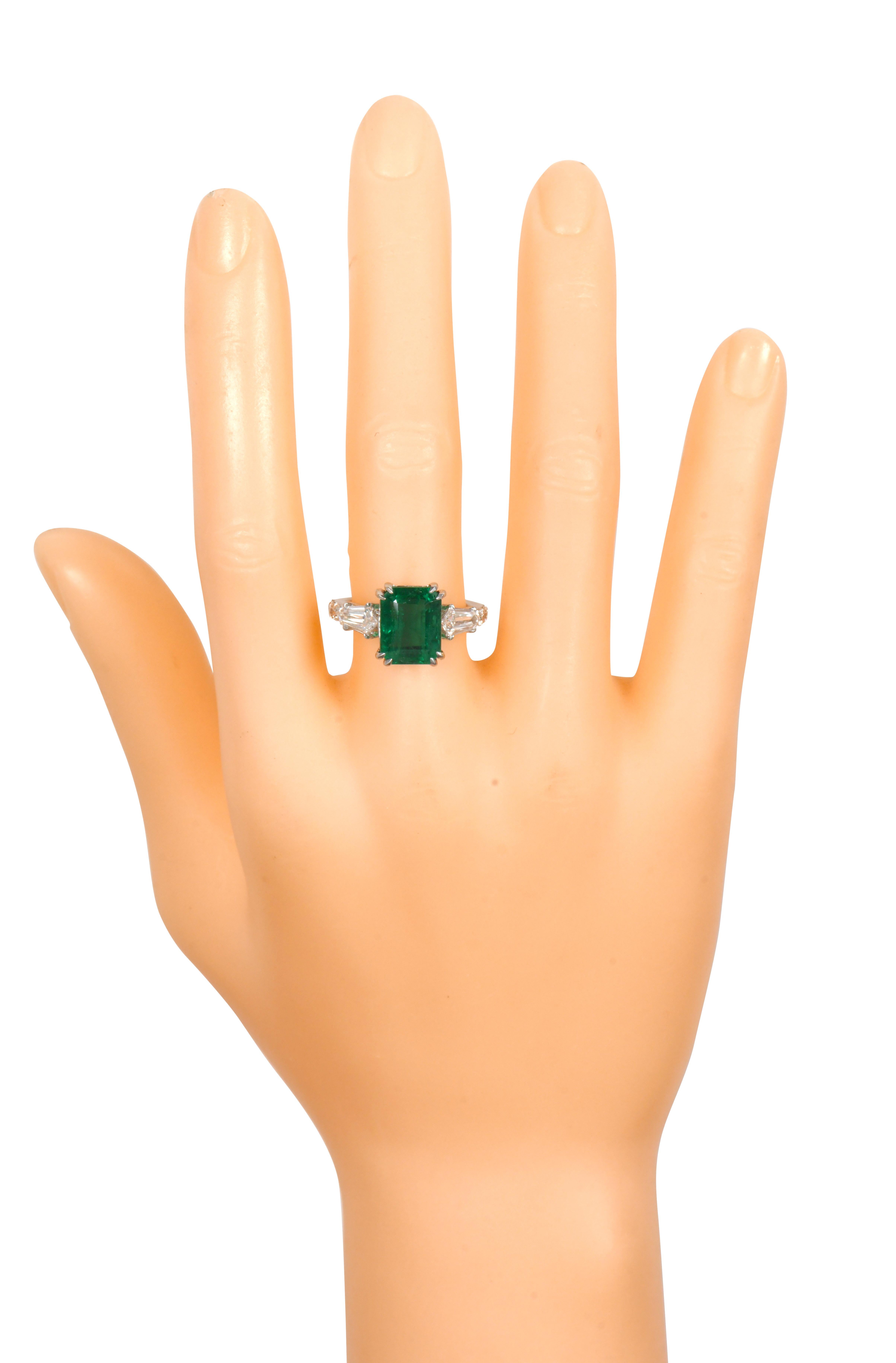 18 Karat White Gold 6.24 Carat Vivid Green Emerald and Diamond Solitaire Cocktail Ring

This glorious trinity vivid green emerald and diamond ring is impeccable. The three-stone trinity ring tells a story by not only representing the said “past,