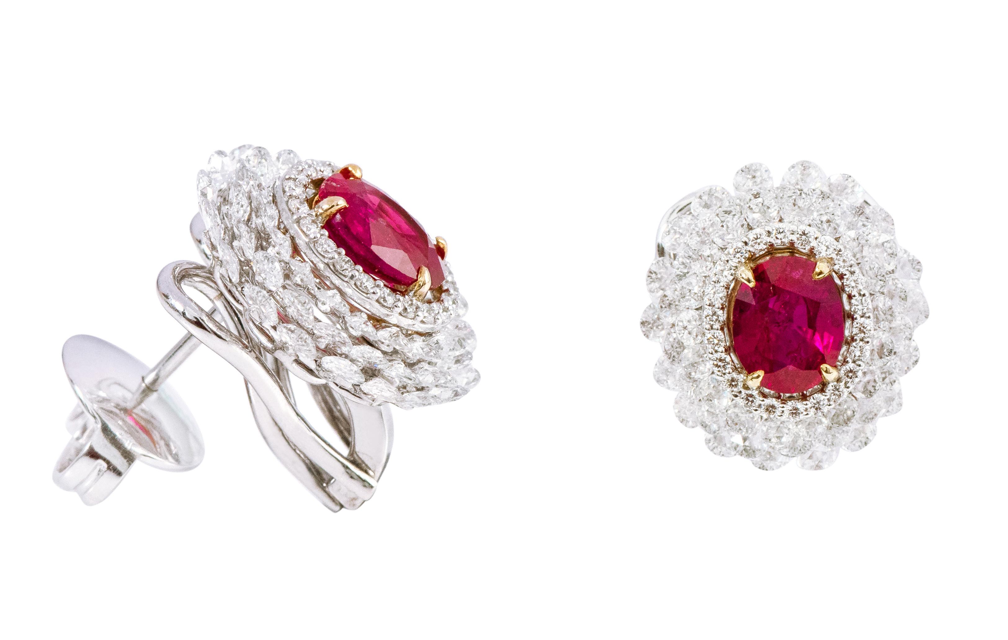 18 Karat White Gold 6.27 Carats Ruby and Diamond Cluster Stud Earrings 

This impeccable crimson red ruby and diamond rose-cut earring is remarkable. The earring sets itself apart with the exquisite solitaire oval ruby surrounded by a thin layer of