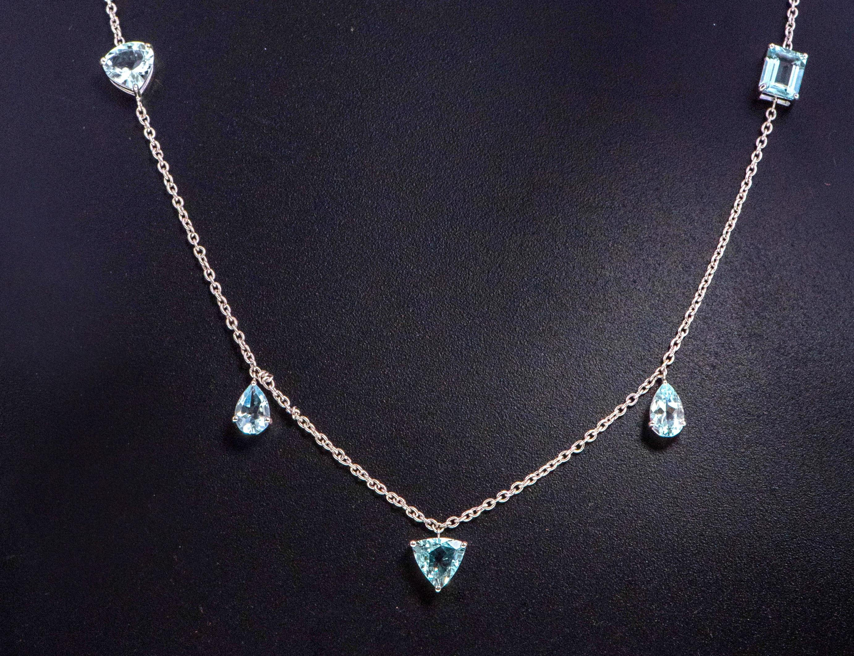 18 Karat White Gold 6.29 Carat Multi-Shape Aquamarine Drop Link Necklace

This phenomenal Santa Marina aquamarine hanging necklace is magical. The 9 mix shape solitaire aquamarines set in the combination of some within the link chain and some