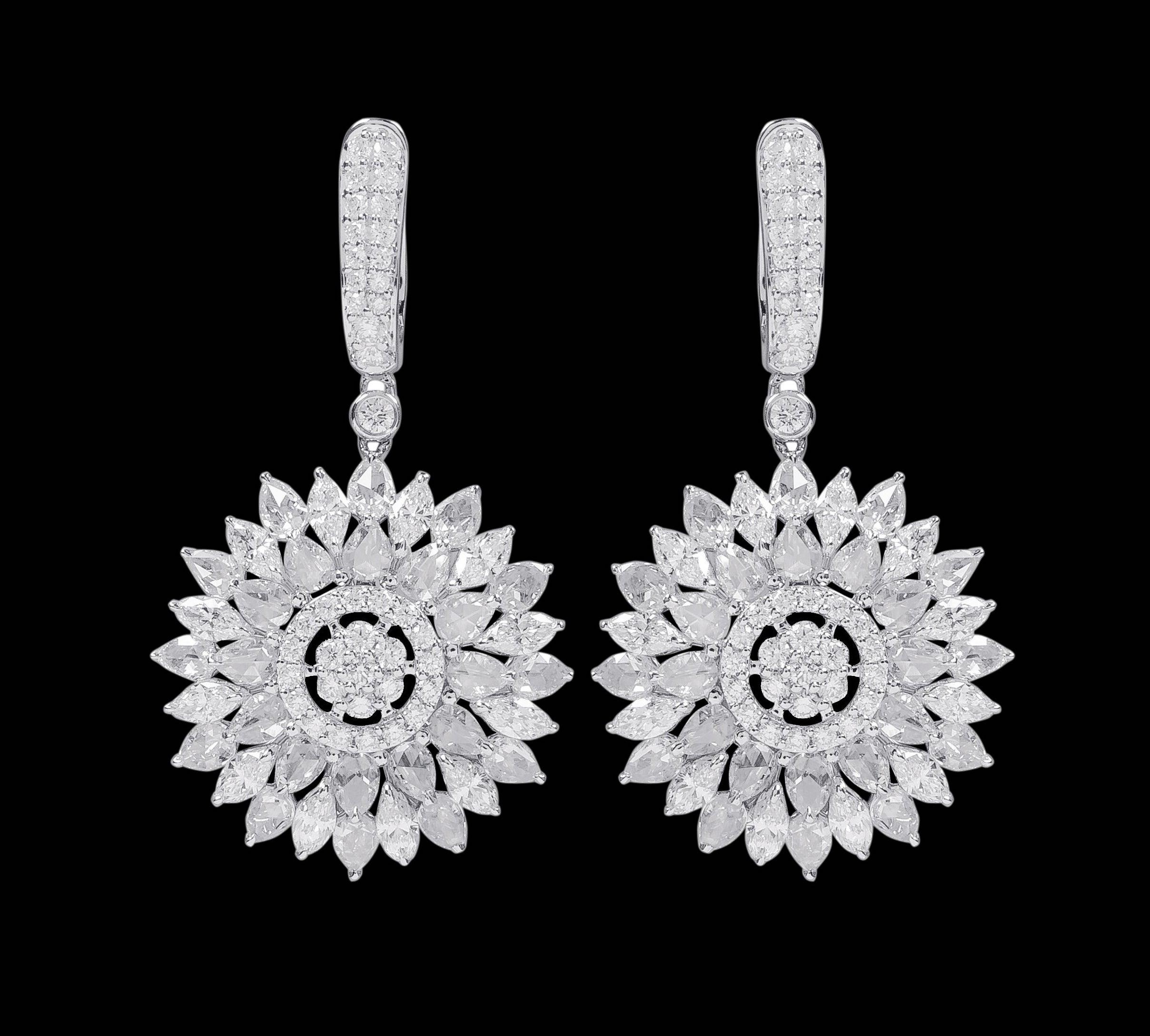 18 Karat White Gold 6.41 Carat Diamond Drop Flower Statement Earrings

This phenomenal mixed solitaire diamond blazing sun earring is vividly magical. The design is magnificently created in various levels to fire up the sun/chakra with the