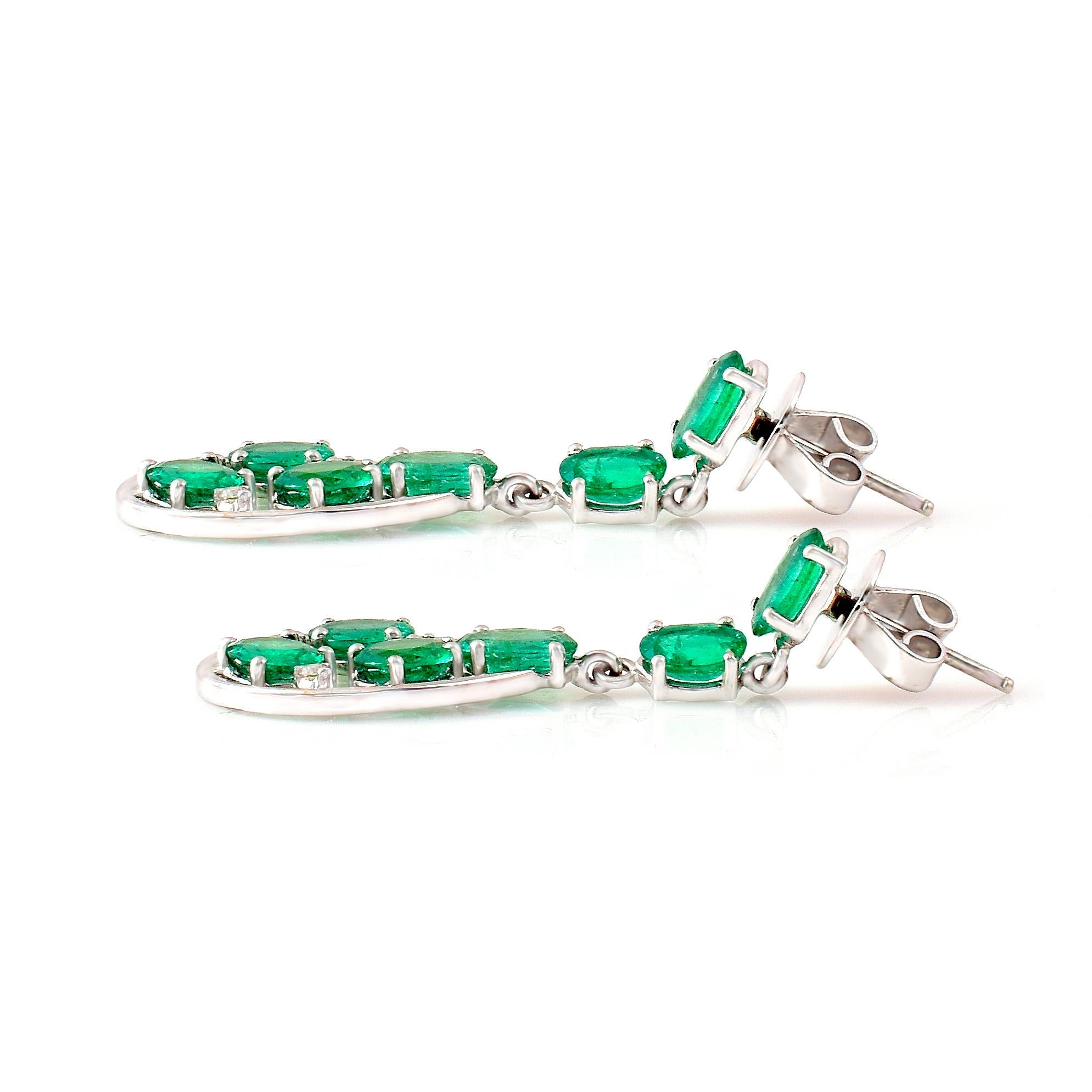 Oval Cut 18 Karat White Gold 6.52 Carat Oval-Cut Emerald and Diamond Dangle Earrings For Sale