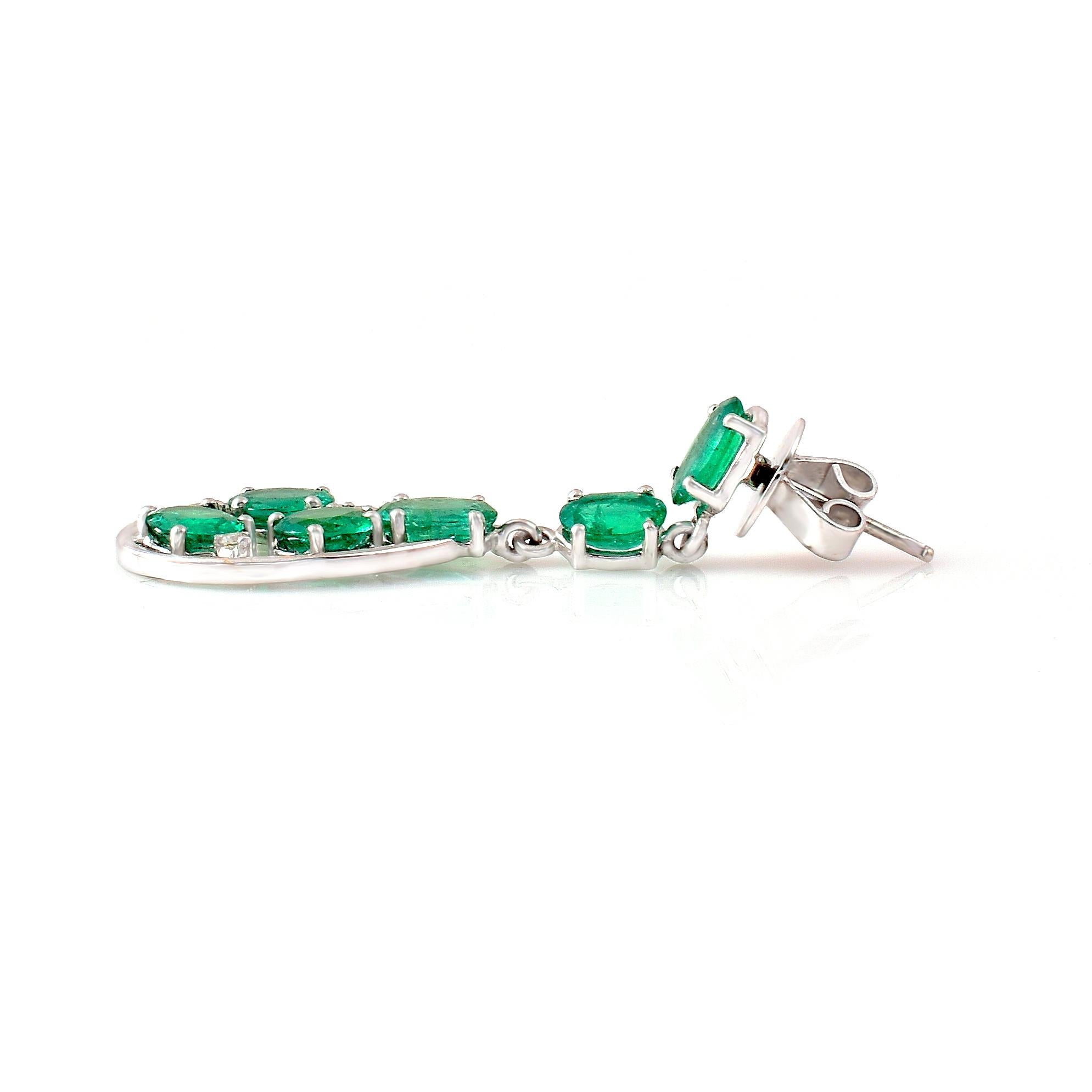 Women's 18 Karat White Gold 6.52 Carat Oval-Cut Emerald and Diamond Dangle Earrings For Sale