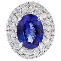 Anillo de oro blanco de 18 quilates con tanzanita ovalada y diamante de 6,53 quilates