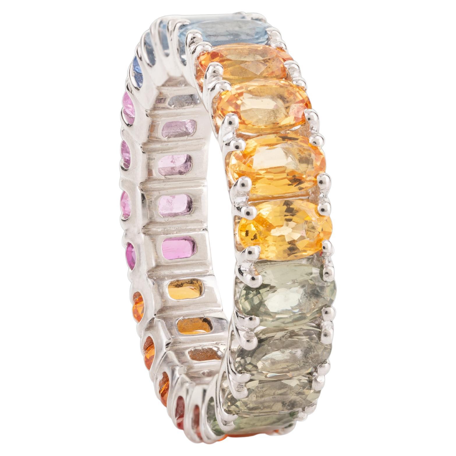 For Sale:  18 Karat White Gold 6.54 Carat Multi Colored Sapphire Eternity Band Ring