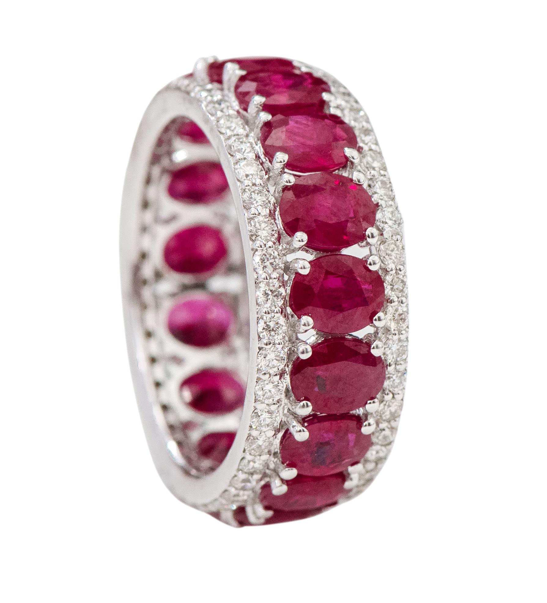 18 Karat White Gold 7.02 Carat Oval-Cut Ruby and Diamond Eternity Band Ring

This impeccable fiery red ruby and diamond band is phenomenal. The solitaire horizontally placed oval shape ruby in grain prong setting is brilliantly surrounded by pave