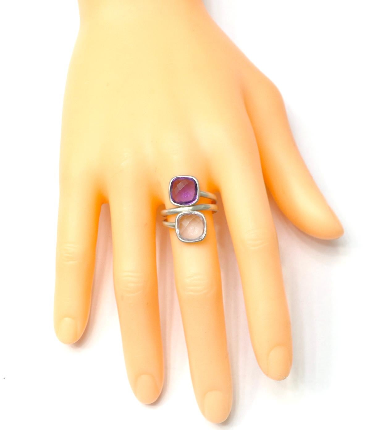 18 Karat White Gold 7.22 Carat Purple and Pink Amethyst Two-Stone Ring

Timeless yet stylish, puristic yet brilliant. This ring is a modern take on the classic spiral trend. Two glistening white gold bands intertwine in elegant, gentle curves with