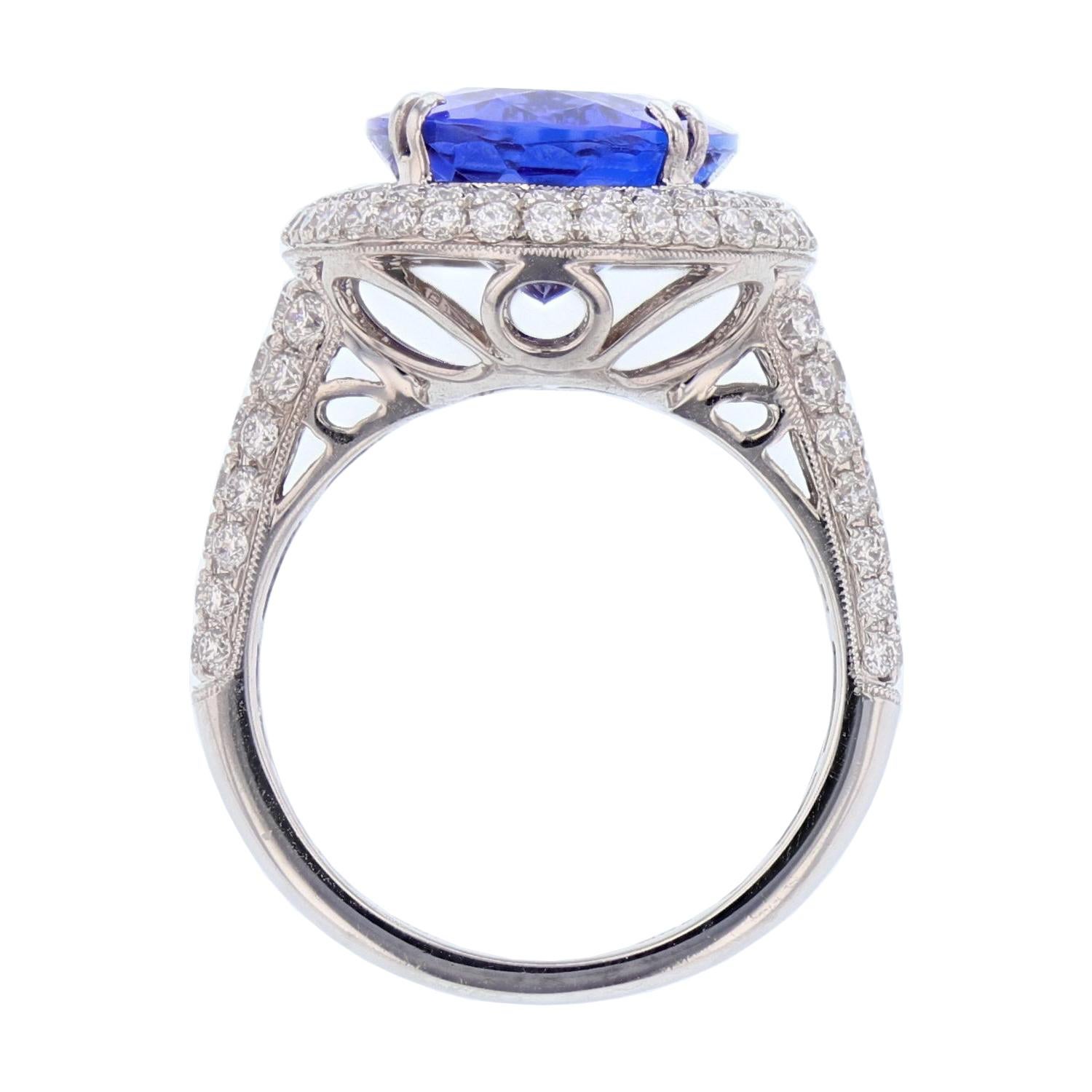 Contemporary 18 Karat White Gold 7.62 Carat Oval Tanzanite and Diamond Ring For Sale
