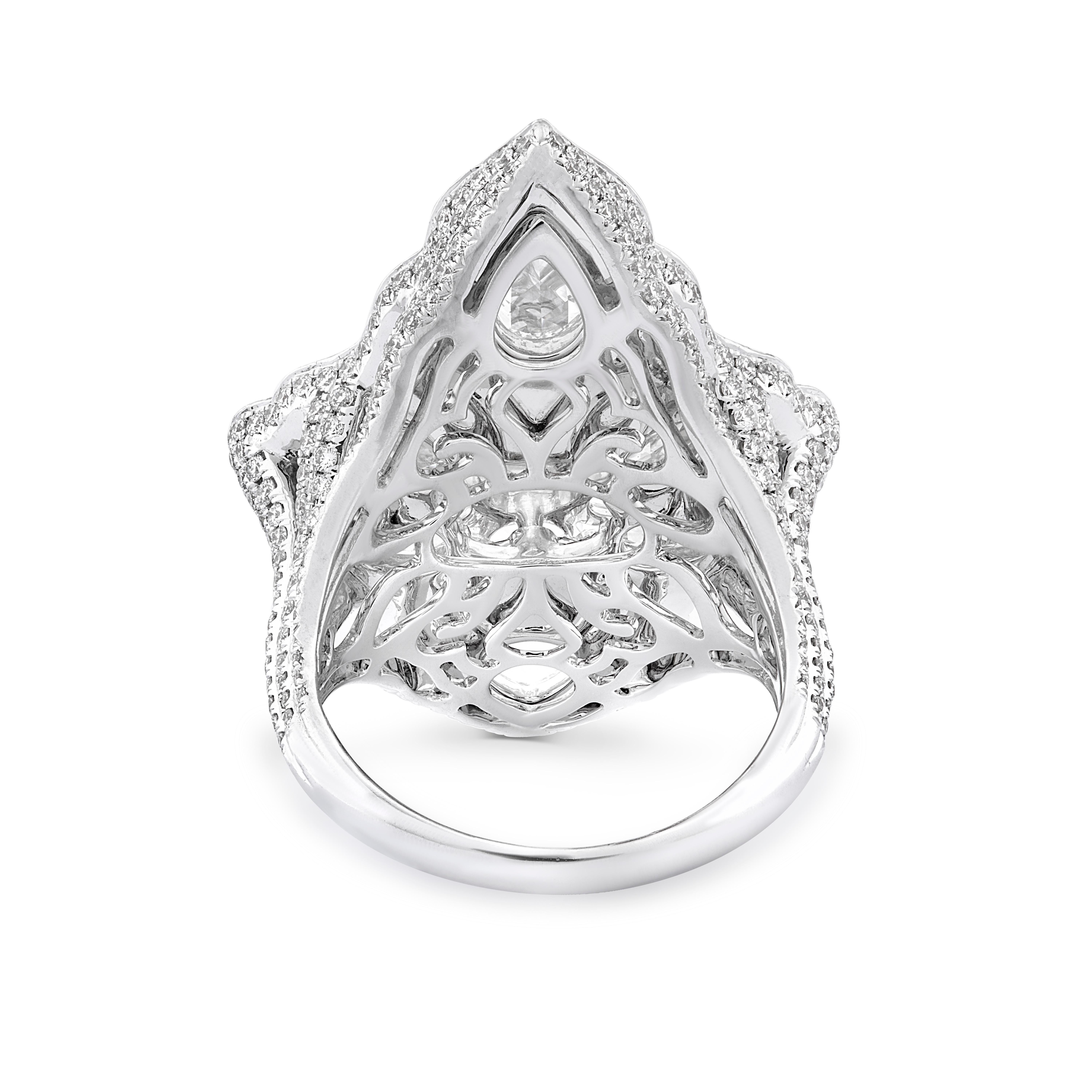 An ode to royalty, this impressive cocktail ring is meticulously crafted with 18 rose-cut diamonds framed by 565 micro pave set diamonds. 

Total diamond weight 5.32cts.
Diamonds are G/H colour VS clarity.
Gold weight: 14.51g