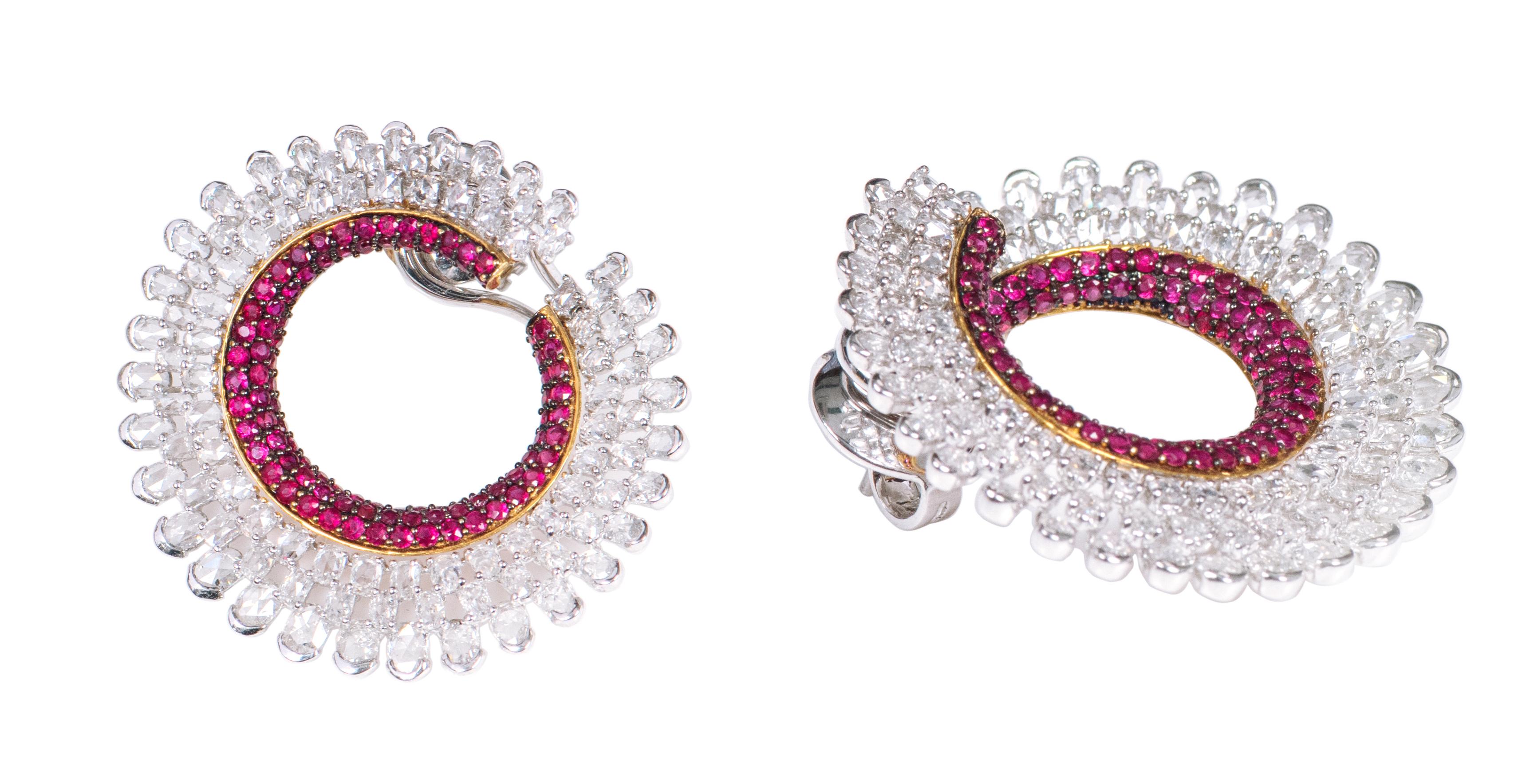 18 Karat White Gold 8.11 Carat Diamond and Ruby Cocktail Stud Hoop Earrings

This glorious blood red ruby and diamond rose-cut modern hoop earring is impeccable. The round pave set rubies are curved inwards forming the magnificent base of this