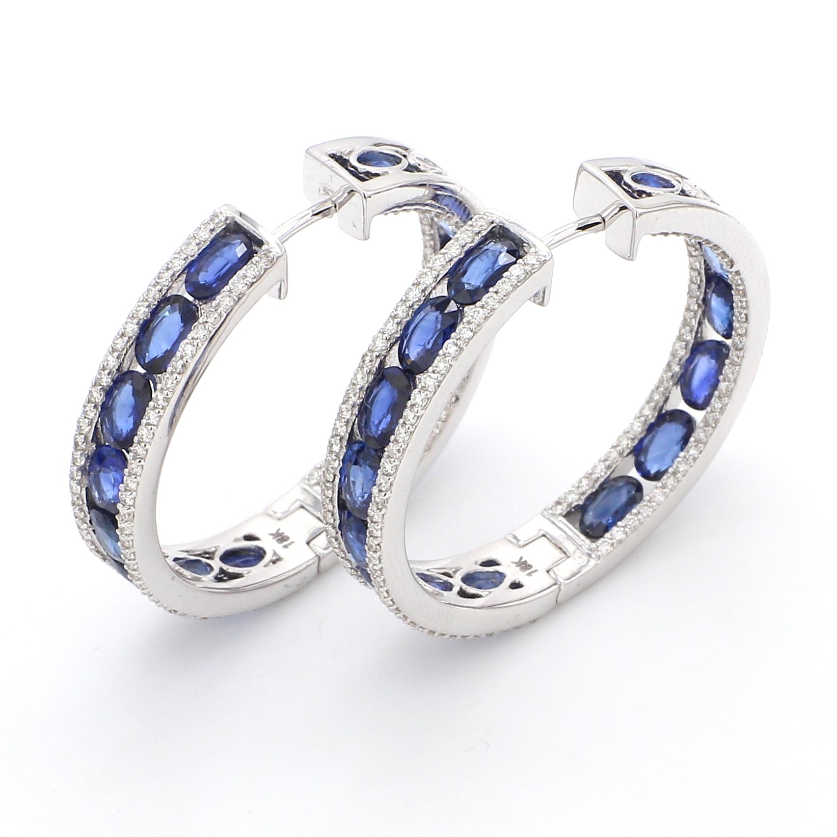 18 Karat White Gold 8.51 Carat Blue Sapphire and Diamond Hoop Earrings 

The modern ear drops (hoops) encircled all around with the azure blue oval sapphires incorporated within an equivalent layer of micro pave set diamonds on either side is