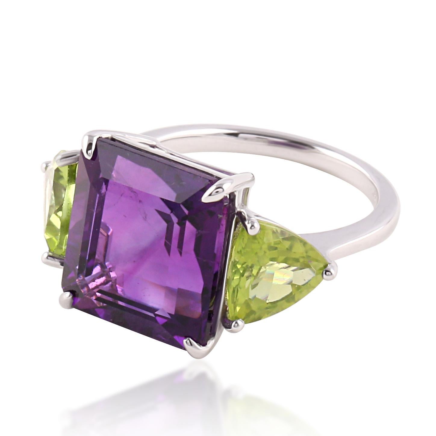 18 Karat White Gold 8.79 Carat Amethyst and Peridot Three-Stone Ring

This classic three-stone ring is glorified with the mix of semi-precious stones merging both amethyst and peridot together. The radiant square-cut amethyst supported by the fancy