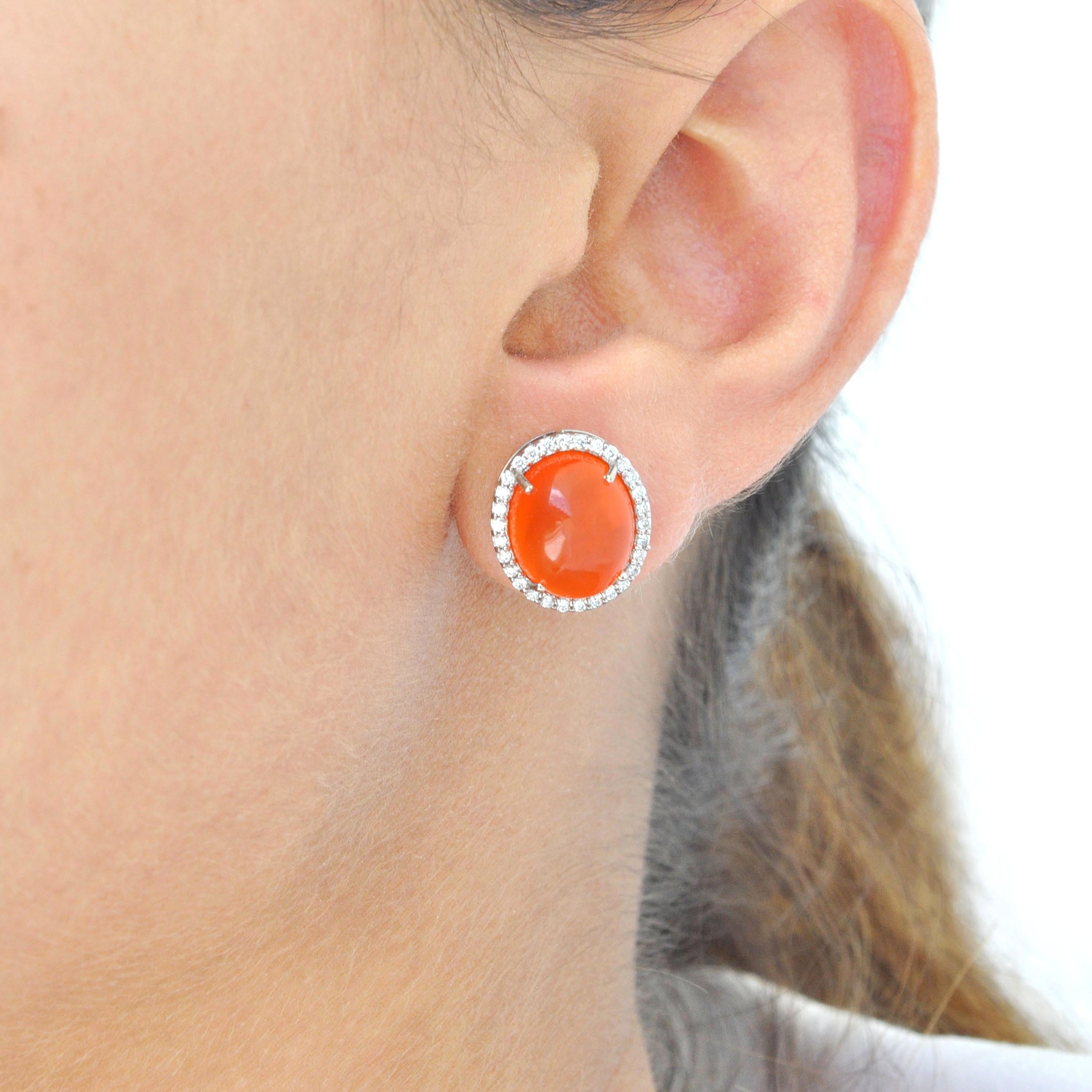 Unveil a bold yet graceful expression of style with these Fire Opal Earrings, meticulously crafted in 18-karat gold. A captivating blend of warmth, color, and sparkle, this pair is designed to illuminate your every moment—whether it’s a refined