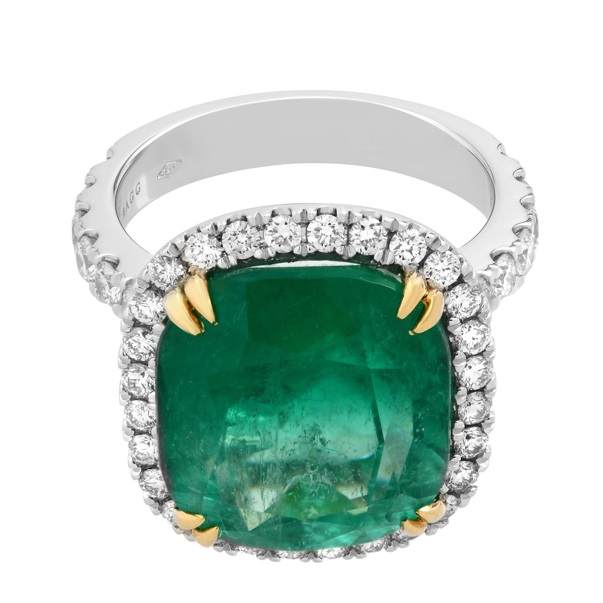 Featuring a gorgeous, rich green 9.23ct genuine Colombian emerald surrounded by a glittering diamond halo. This beautiful emerald has excellent faceting and full of sparkle. Set with yellow gold double claw prongs. Emerald measurements: 13.42 x