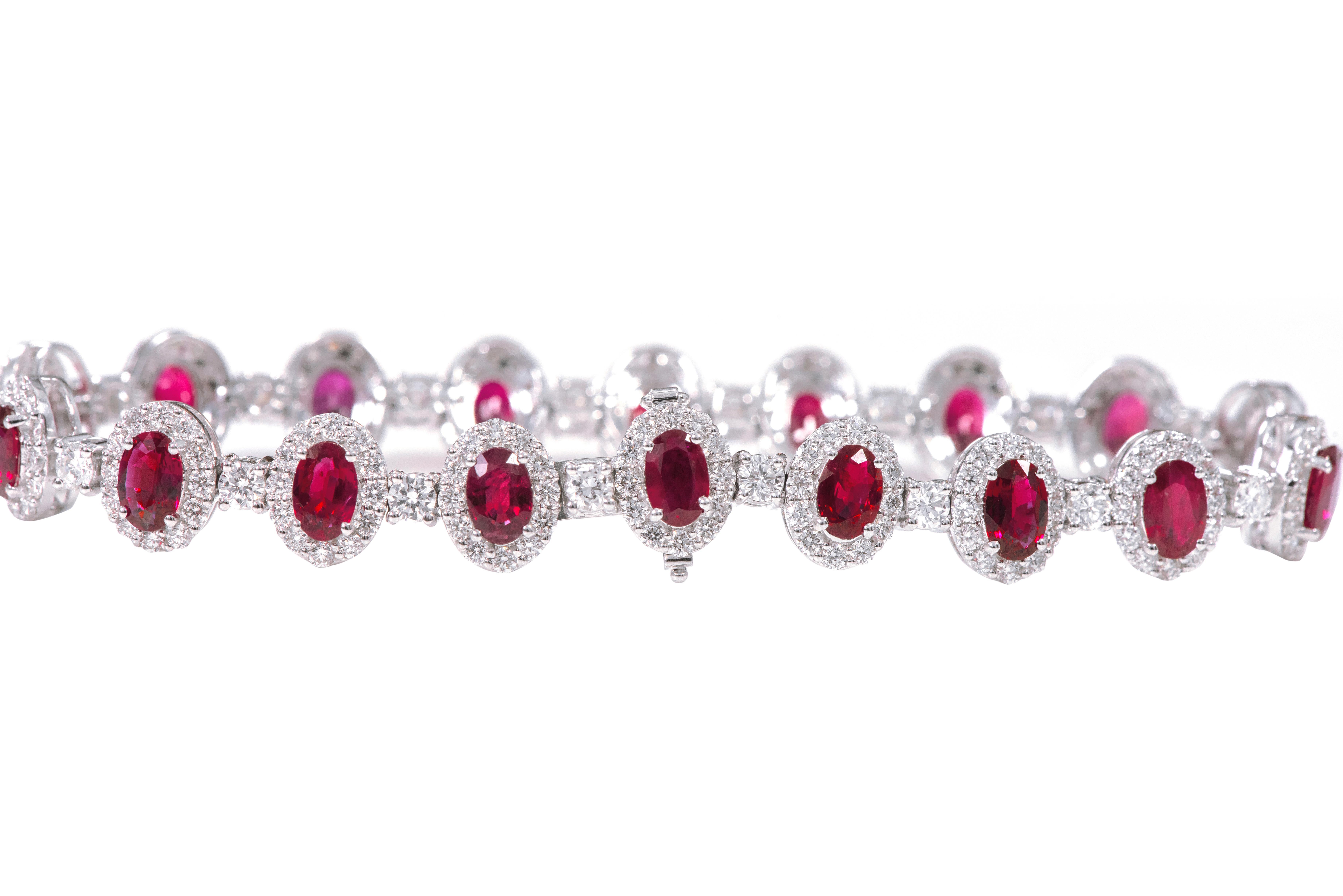 18 Karat White Gold 9.60 Carat Ruby and Diamond Cluster Modern Bracelet

This impressive deep red ruby and diamond tennis bracelet is remarkably brilliant. The solitaire oval rubies are magnificently surrounded with a layer of pave set round