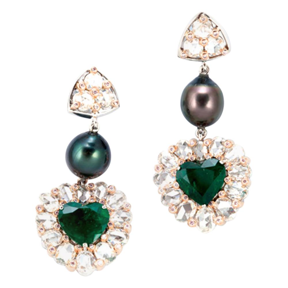 18 Karat White Gold All Seeing Eye Earring with 6.4 Carat Heart Shaped Emeralds For Sale