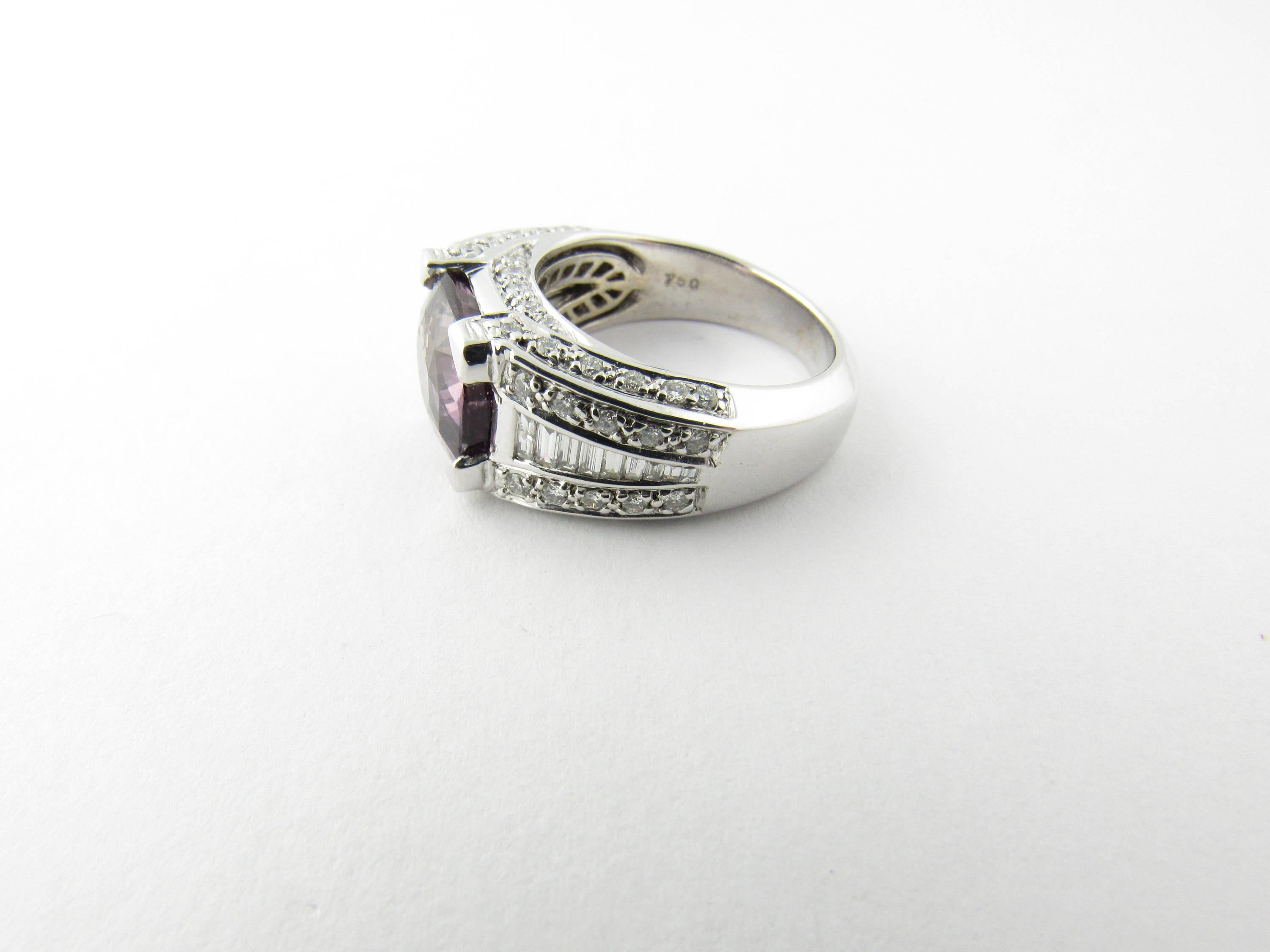 Vintage 18 Karat White Gold Amethyst and Diamond Ring Size 6.75- 
This stunning ring features a genuine amethyst in its center (10 mm x 9 mm) adorned with nine baguette diamonds on each side (.40 ct.) and surrounded by 34 round brilliant cut
