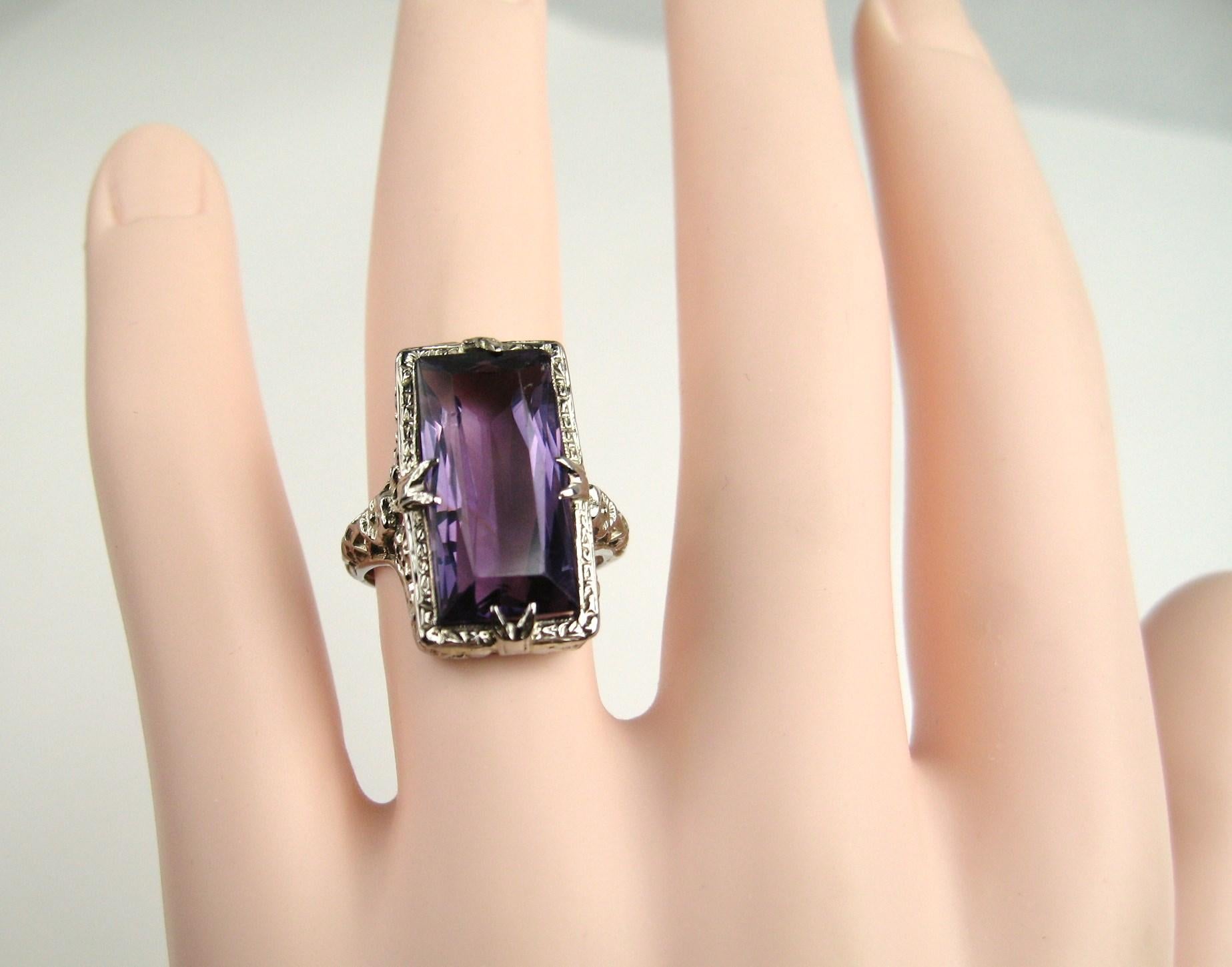 Lovey Large Amethyst 18k white gold Art Deco ring. Deep purple amethyst, with a stunningly crafted detailed filigree setting. Large faceted amethyst stone measuring approximately 7.45 carats. This would make a wonderful engagement ring. The ring is
