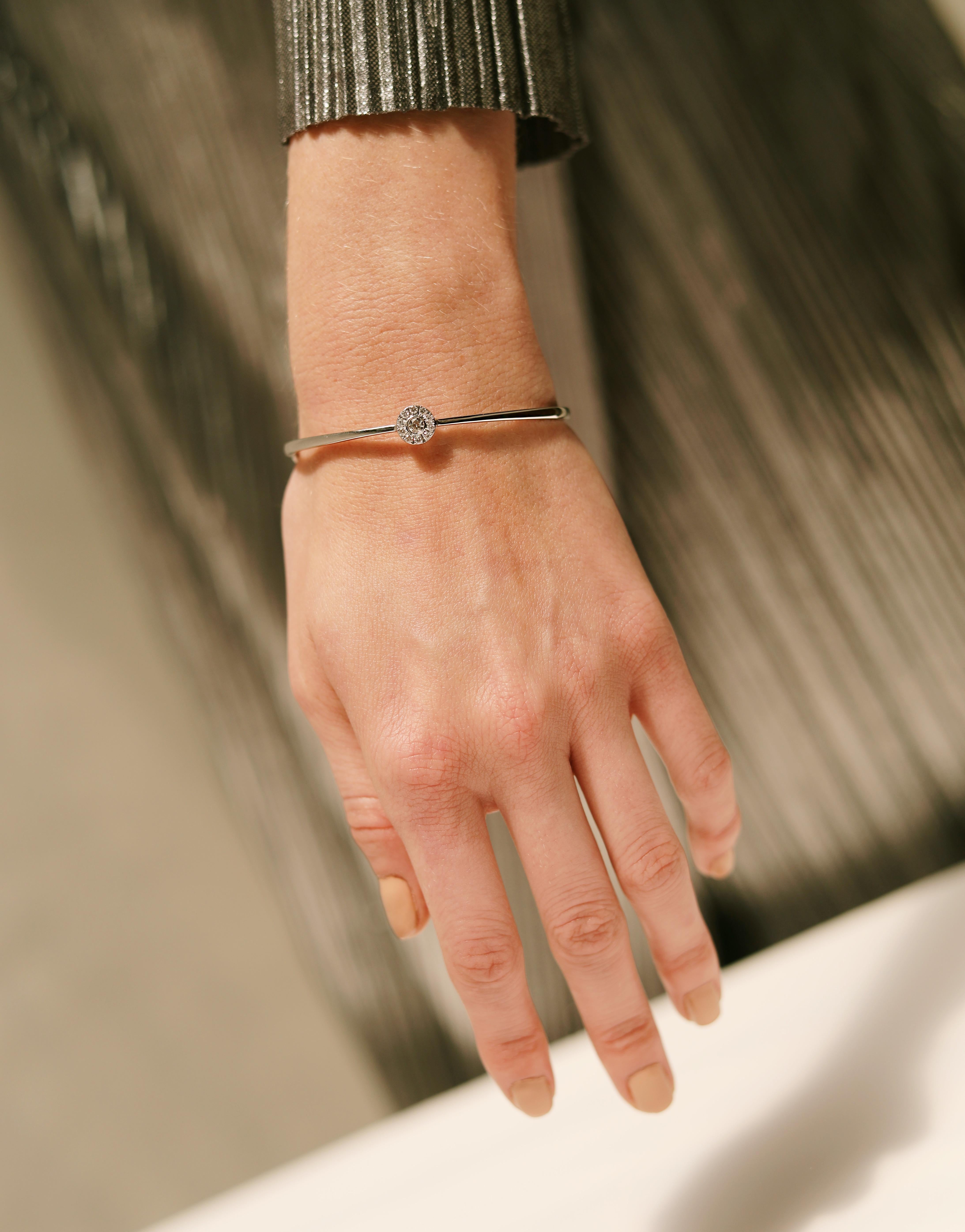 True radiance, created to not just embellish, but enhance a woman’s natural beauty. A stellar collection, Clique blends perfectly matched diamonds, set in white gold, surrounded by spheres of pave diamonds.

Product Name: Clique Bangle 
Diamonds:
