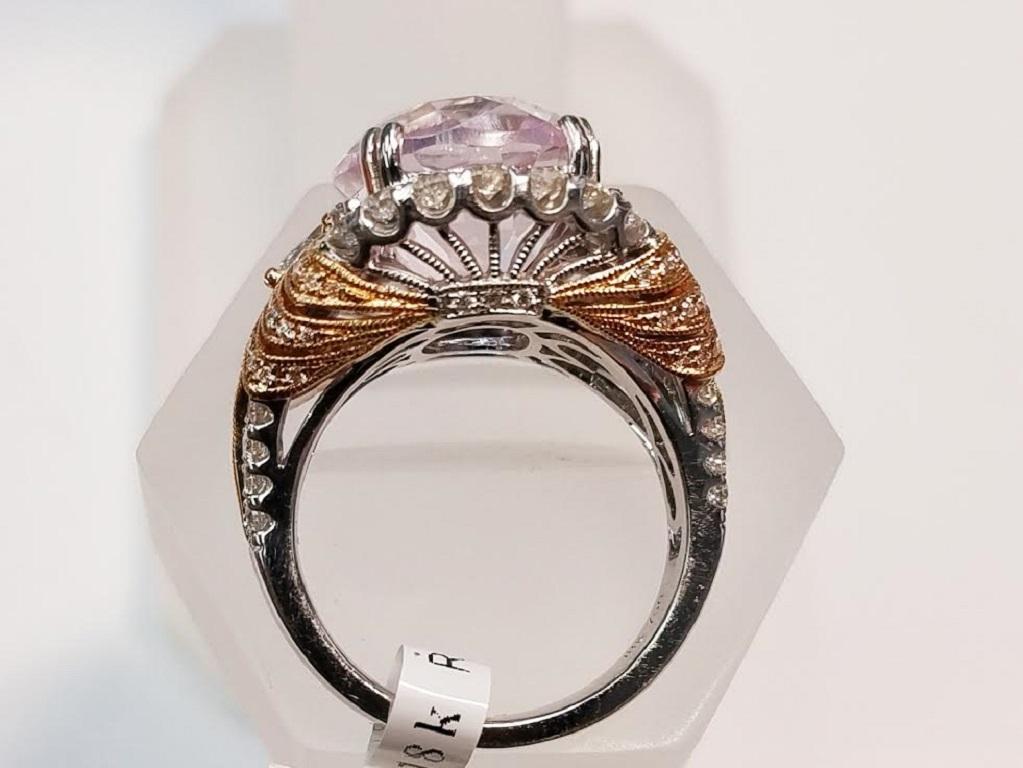 18 Karat White Gold and 18 Karat Rose Gold Oval Cut Kunzite and Diamond Ring
10.06 Carats of Natural Kunzite
1.49 Carats of Genuine Diamonds
Oval Cut
18 Karat White Gold and 18 Karat Rose Gold
