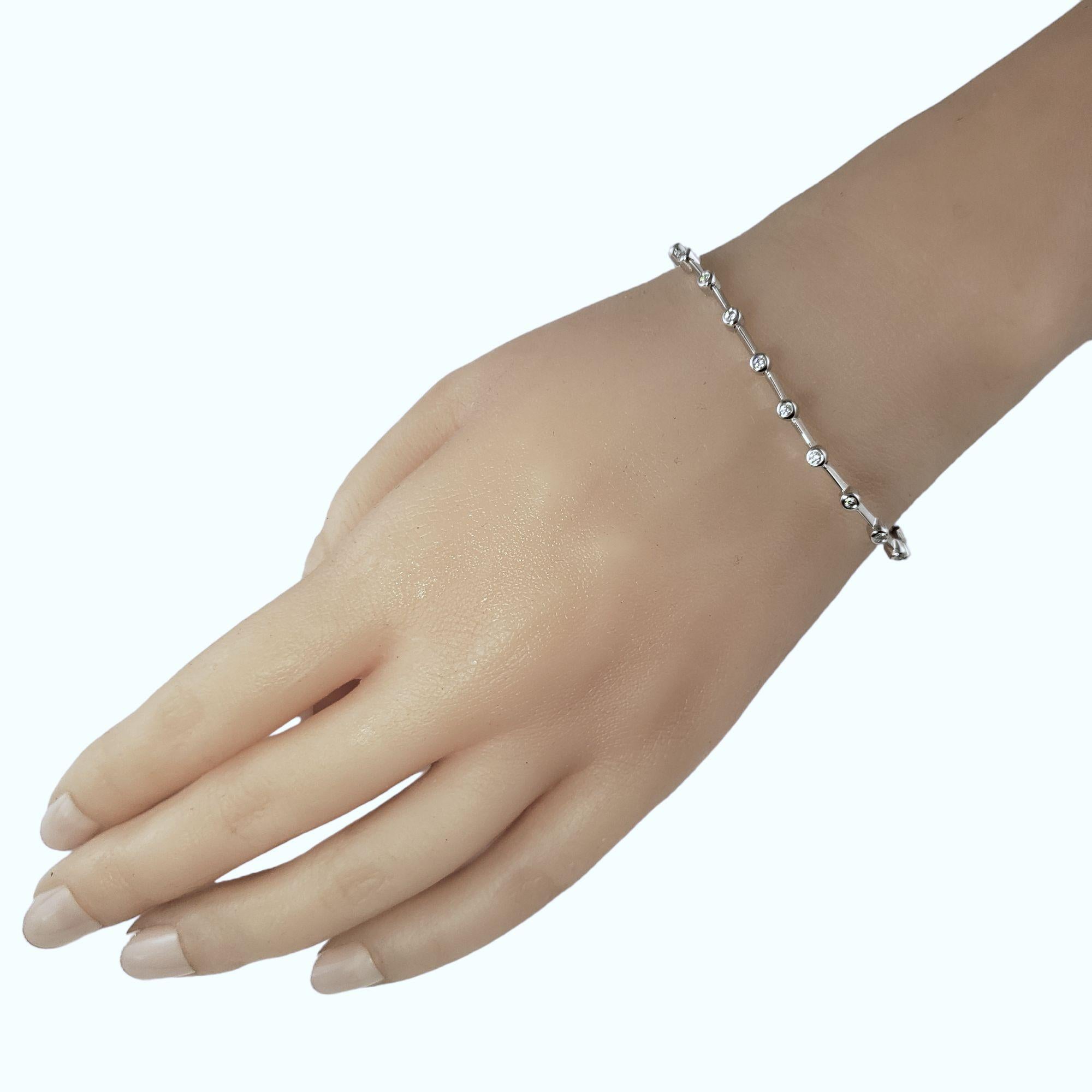 Round Cut 18 Karat White Gold and Bezel Set Diamond Bracelet For Sale