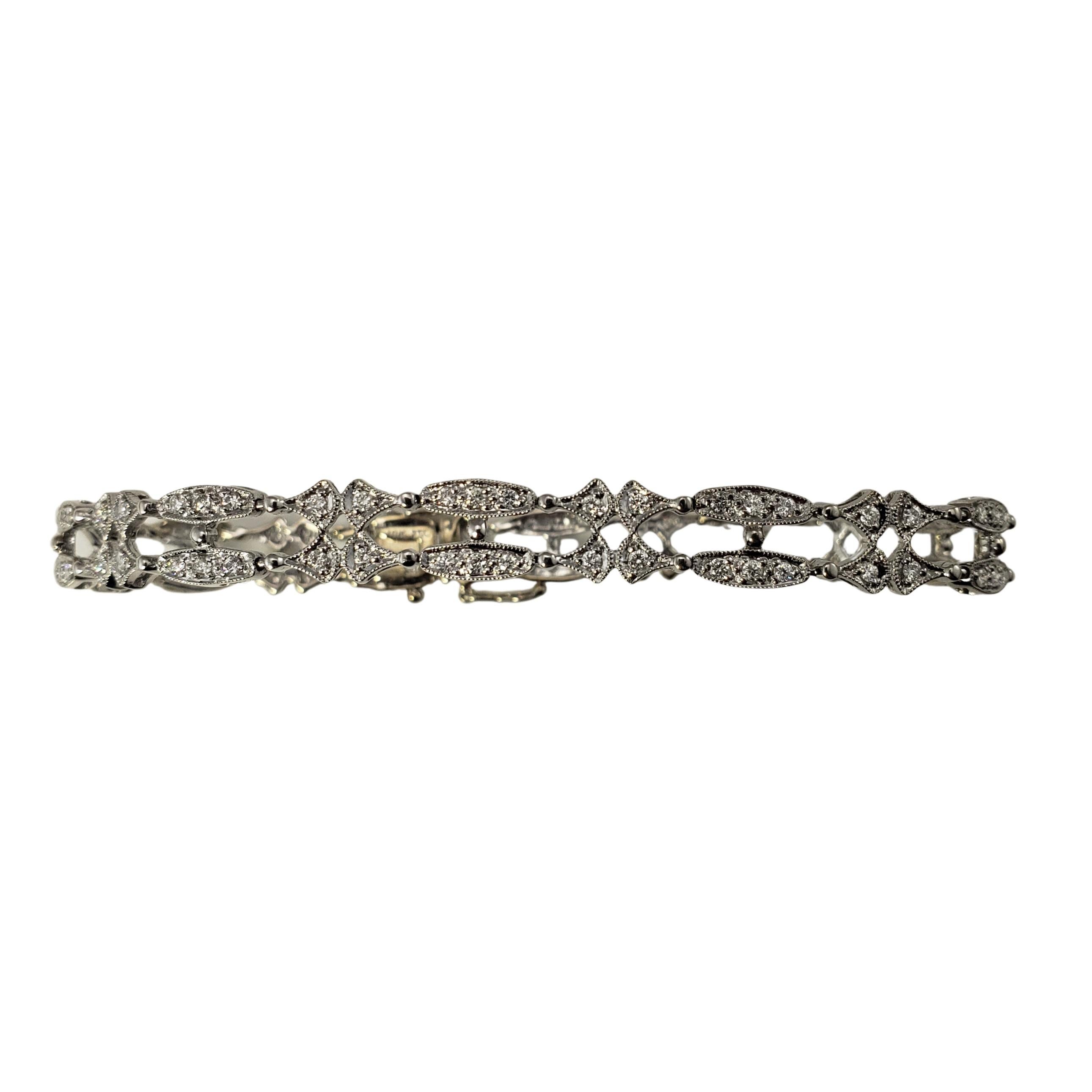 18 Karat White Gold and Diamond Bracelet-

This sparkling bracelet features 100 round brilliant cut diamonds set in beautifully detailed 18K white gold.  Width:  7 mm.

Approximate total diamond weight:  .50 ct.

Diamond color: H-I

Diamond clarity: