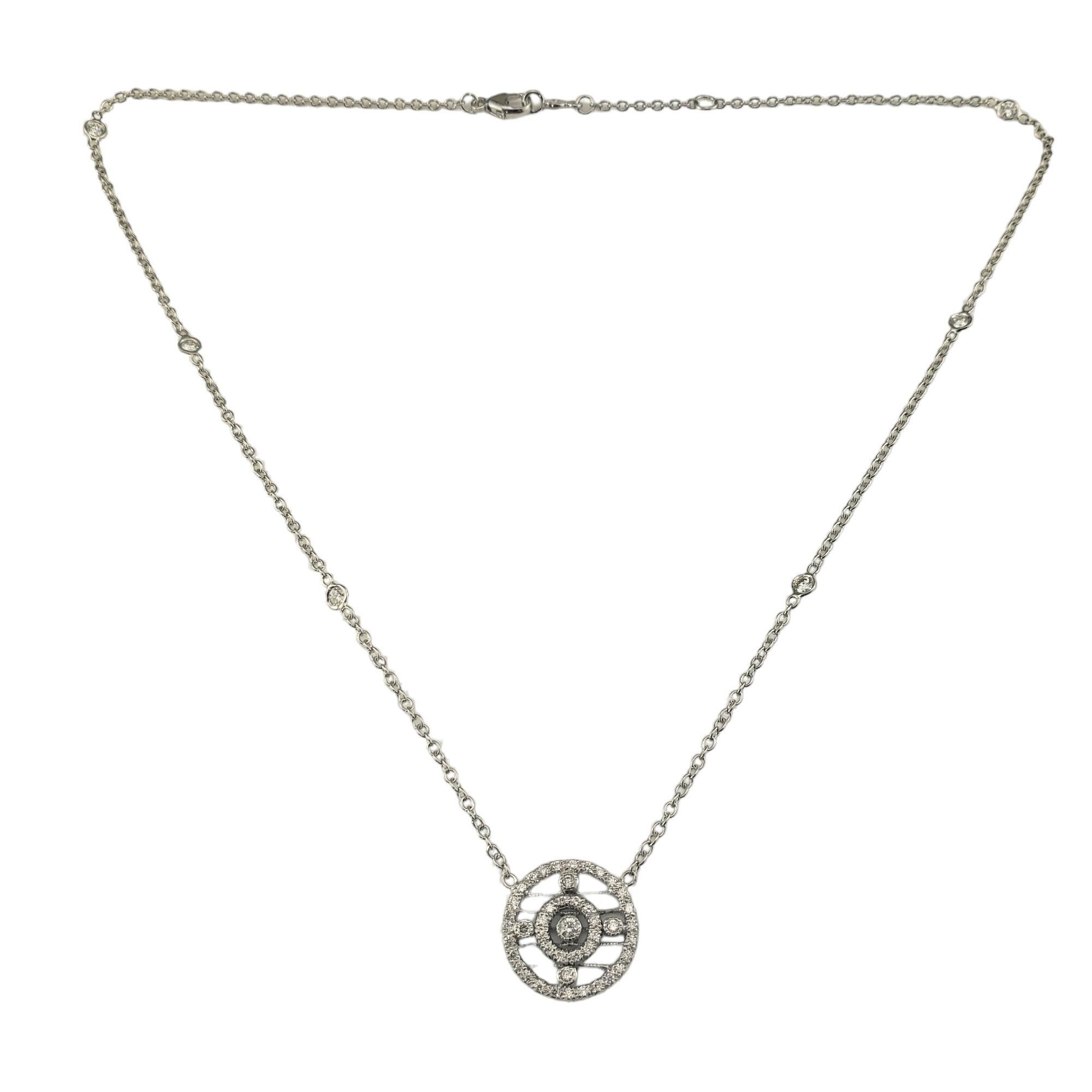 18 Karat White Gold and Diamond Circle Pendant Necklace

This sparkling pendant necklace features 49 round brilliant cut diamonds (43 in pendant, 6 on chain) set in beautifully detailed 18K white gold. 

Approximate total diamond weight: .65
