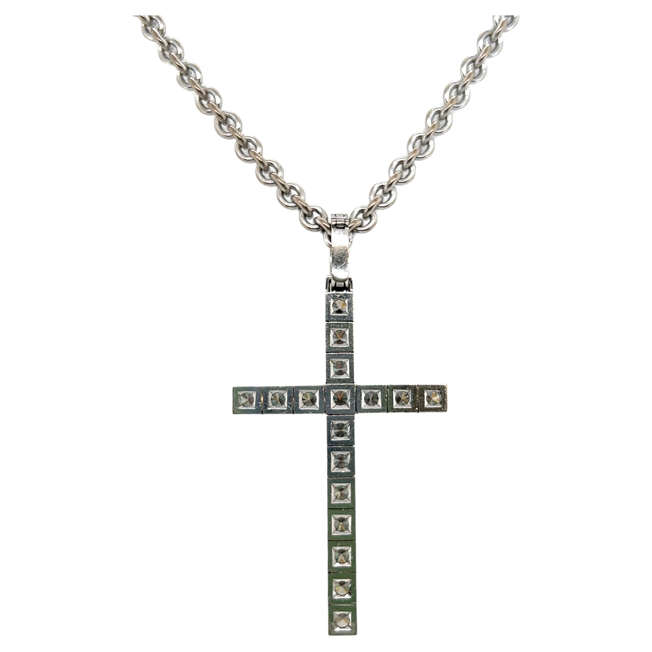 Extraordinary 18 karat white gold and diamond cross pendant with chain by renowned Swiss tradition jewelry house Meister.

Pendant designed as a cross and set with 17 brilliant-cut diamonds totalling circa 2.70 carats. The hinged bail is