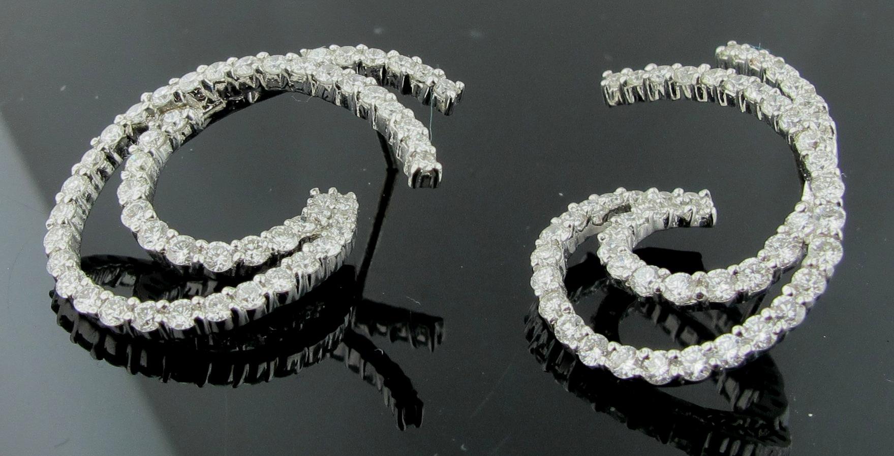 Round Cut 18 Karat White Gold and Diamond Earrings in Double Swirl