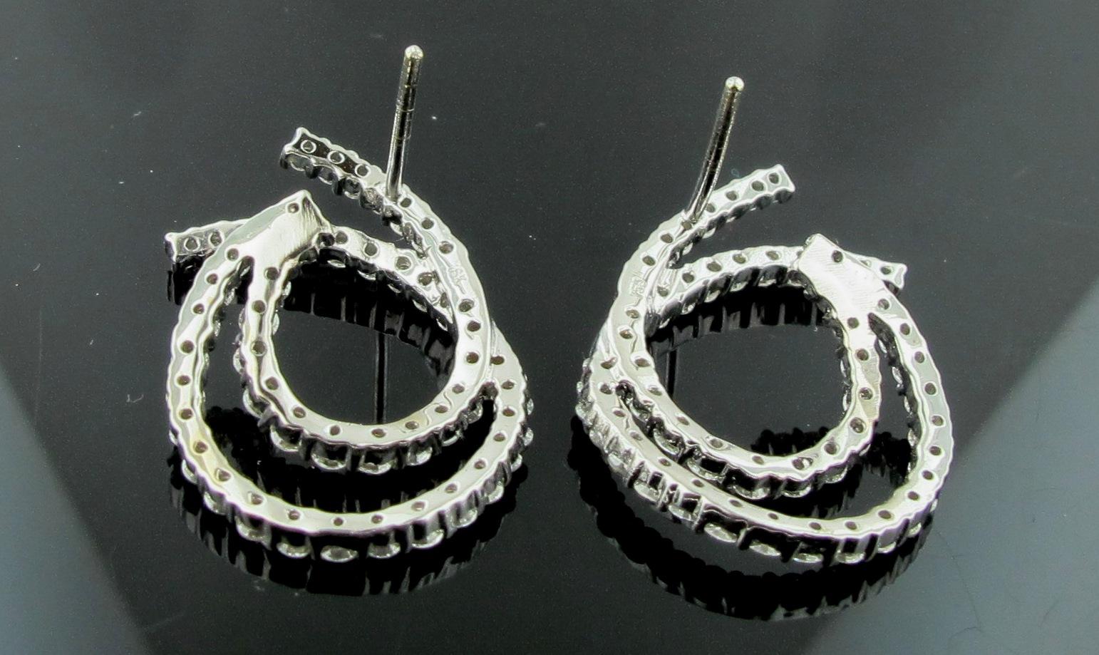 18 Karat White Gold and Diamond Earrings in Double Swirl 1