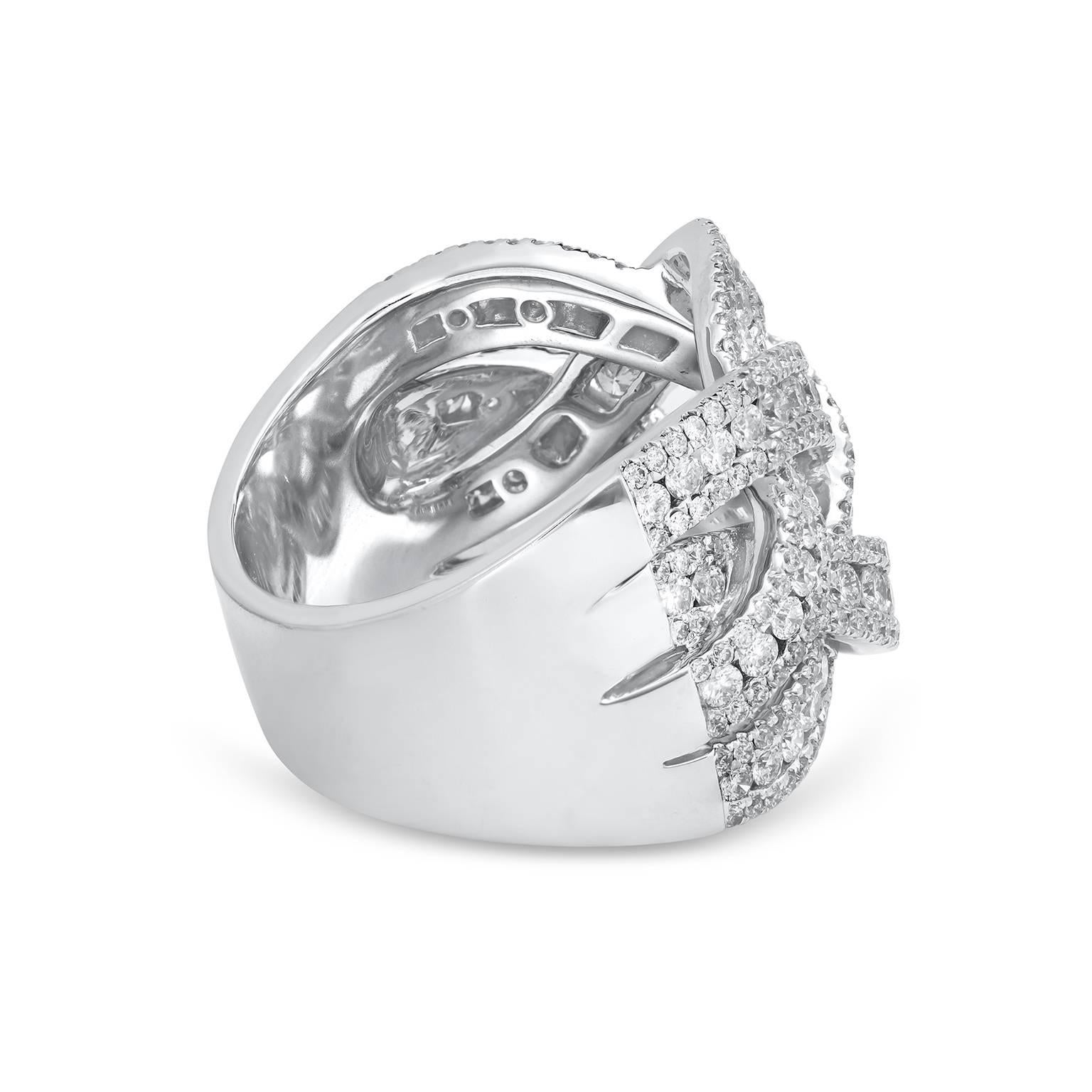 A gorgeous piece of jewelry featuring an intricately-designed intertwined design set with sparkling diamonds. Each intertwining line set with three rows of diamonds for a gorgeous sparkle finish. Diamonds weigh 2.38 carats total. 18k white gold