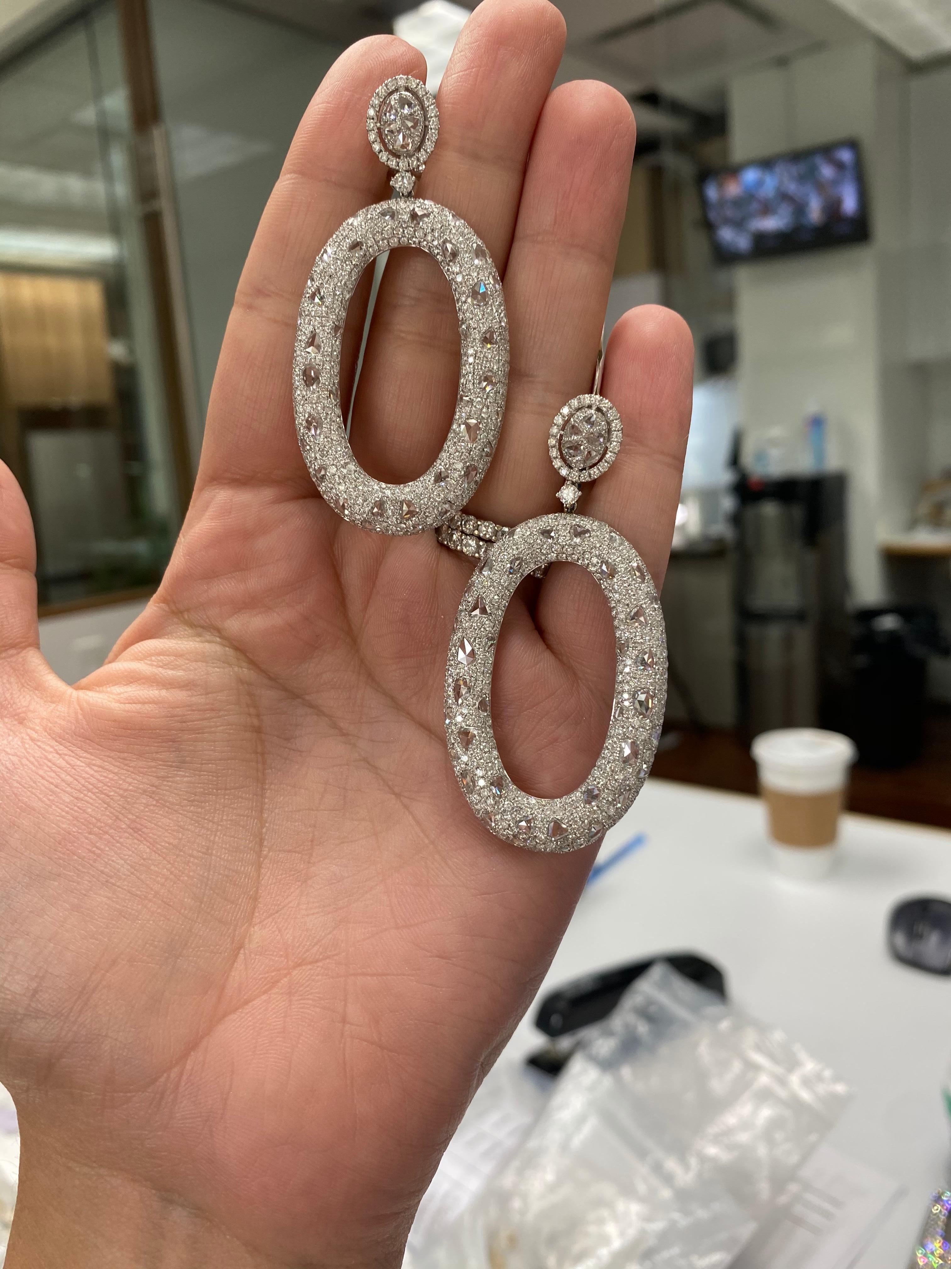 Oval drop pave diamonds throughout
Faceted diamond oval post with pave border
Round cut diamond at link
Omega back closure
Length of drop: 2.5