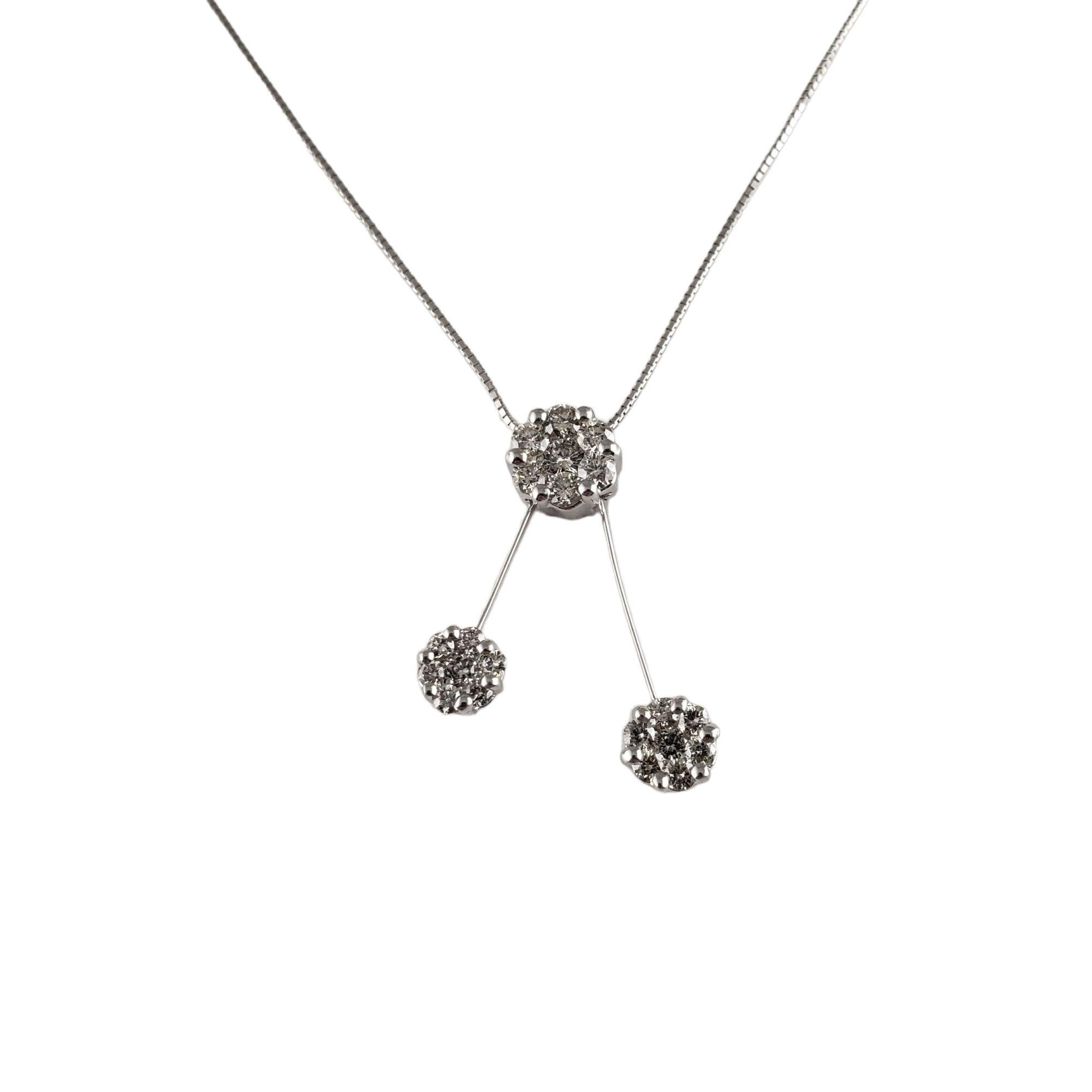 Vintage 18 Karat White Gold and Diamond Pendant Necklace-

This sparkling 18K white gold necklace features 21 round brilliant cut diamonds set in a lovely floral design.

Approximate total diamond weight: .98 ct.

Diamond clarity: SI2-I1

Diamond