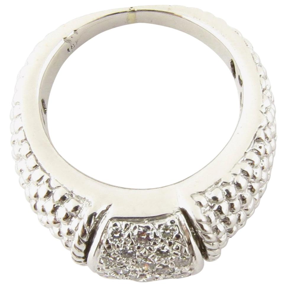 Vintage 18 Karat White Gold and Diamond Ring Size 6.25. This dazzling dome ring features 22 round brilliant cut diamonds set in beautifully detailed 18K white gold. 
Width: 9 mm. Height: 8 mm. Shank: 2 mm. Approximate total diamond weight: .46 ct.