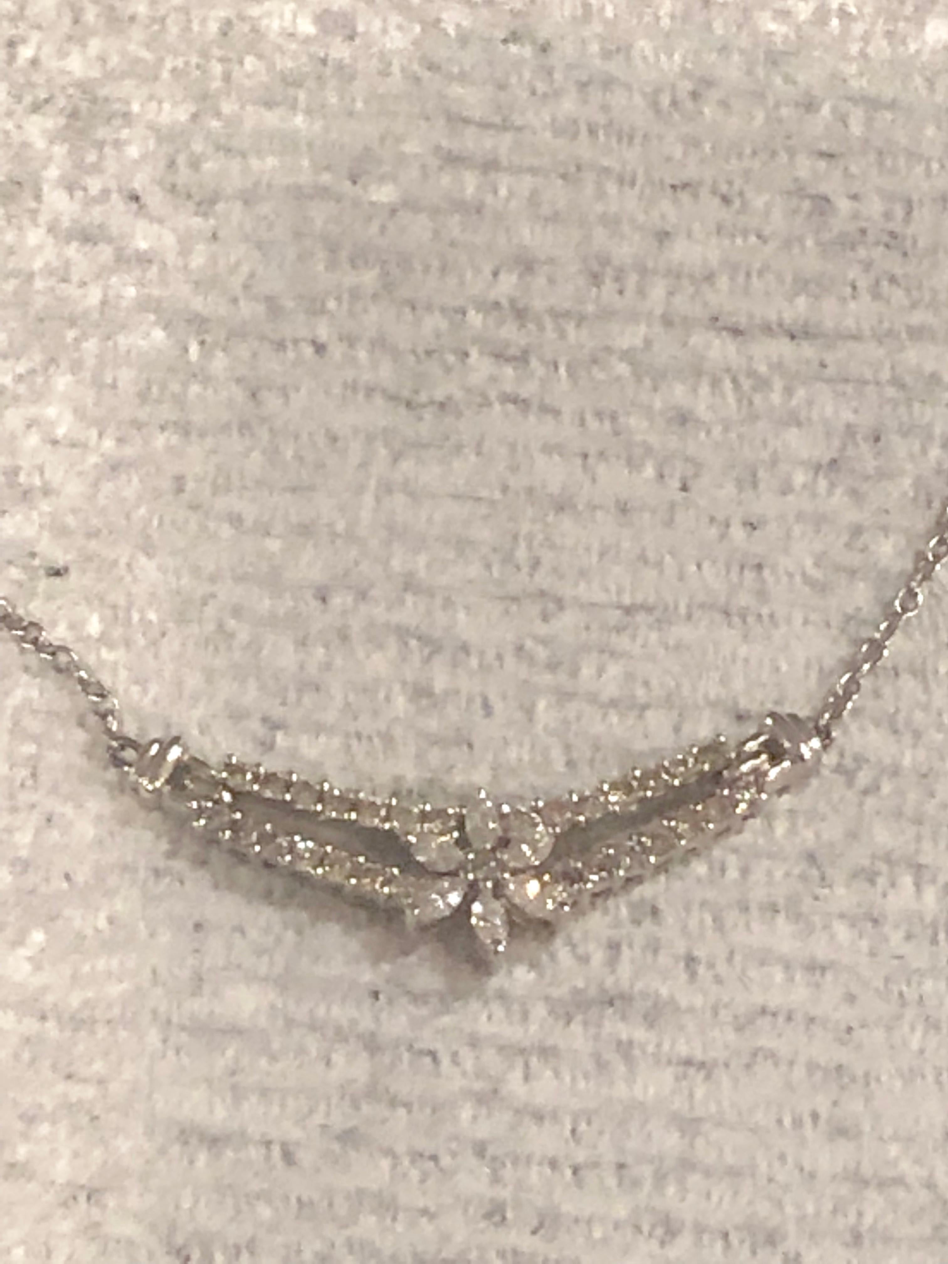 18 Karat White Gold And Diamond Soldered Pendent Necklace 
16 Inches
With 29 diamonds at 1.50 Total Round Diamonds and 6 diamonds at .50 total Marquise Diamonds
2.00 TDW
6.35 Grams total weight