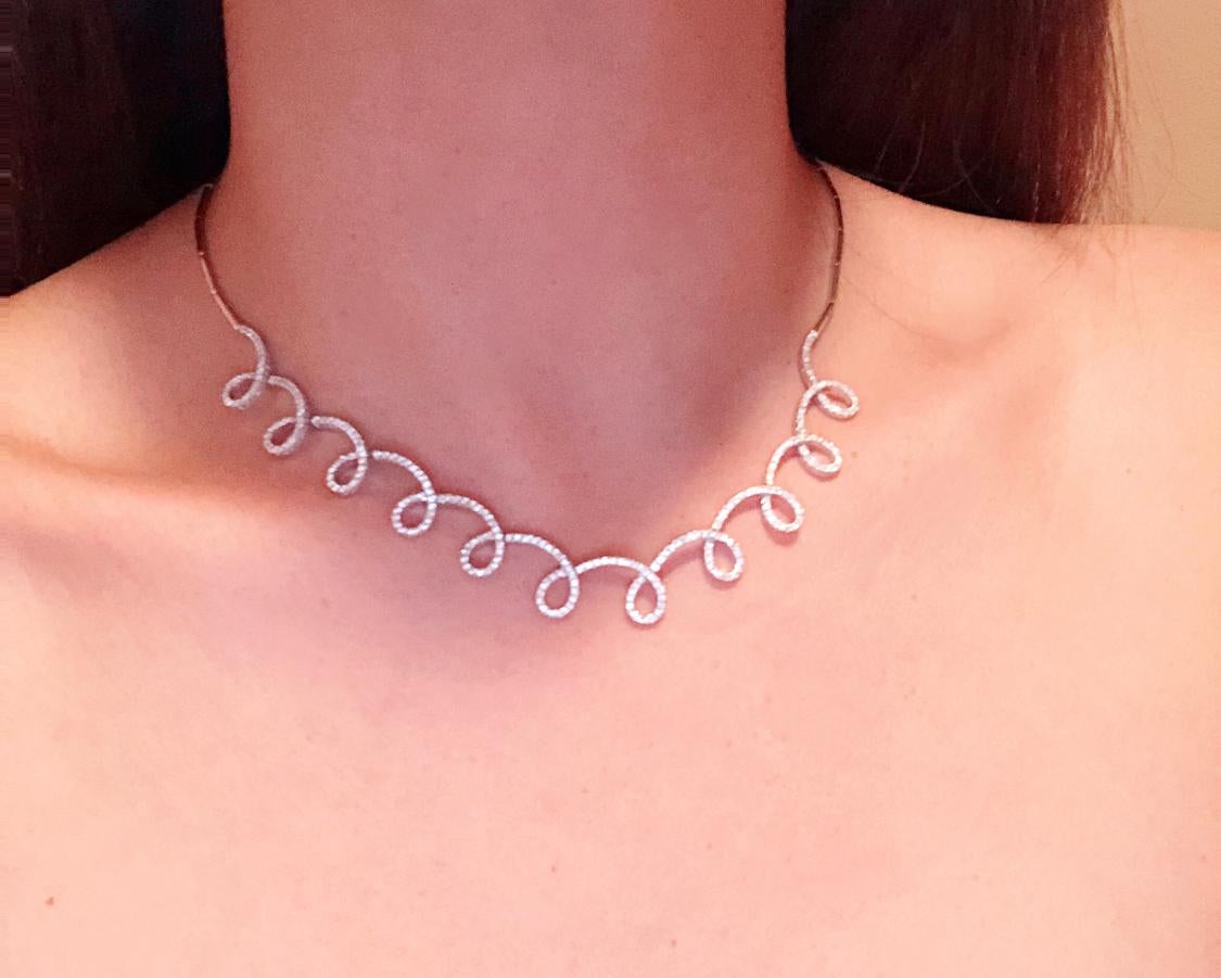 18 Karat White Gold and Diamond Swirl Necklace by H2 at Hammerman.
H2 at Hammerman white gold swirl necklace with pave diamond details, total diamond carat weight is 1.53, diamond color is G-H, diamond clarity is SI, 16 inch long, 0.45 inch at