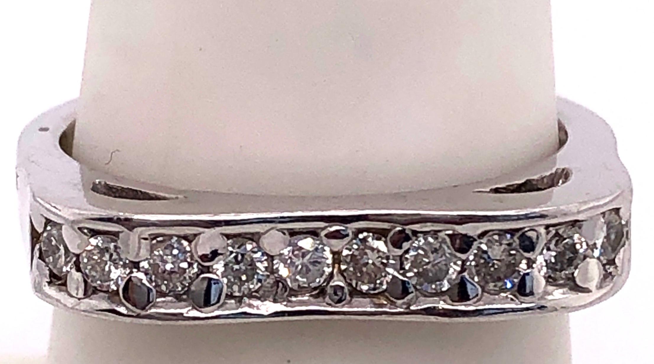 14 Karat White Gold Contemporary Ring with Diamonds.
0.25 total diamond weight.
Size 7.5
4.38 grams total weight.